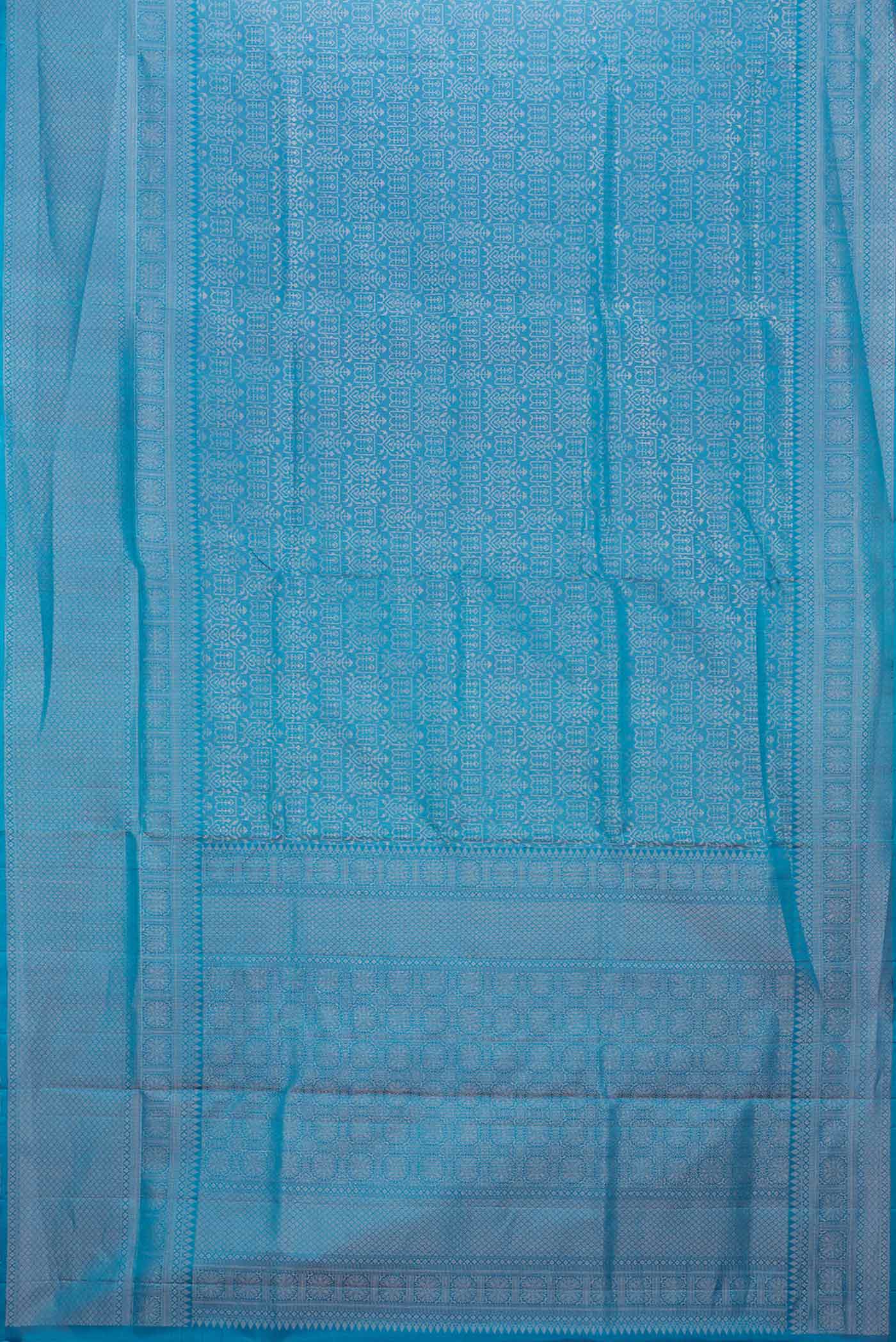 Flat view of Peacock Blue Dual Tone Soft Silk Saree with Zari Brocade on the body and Zari Border. 