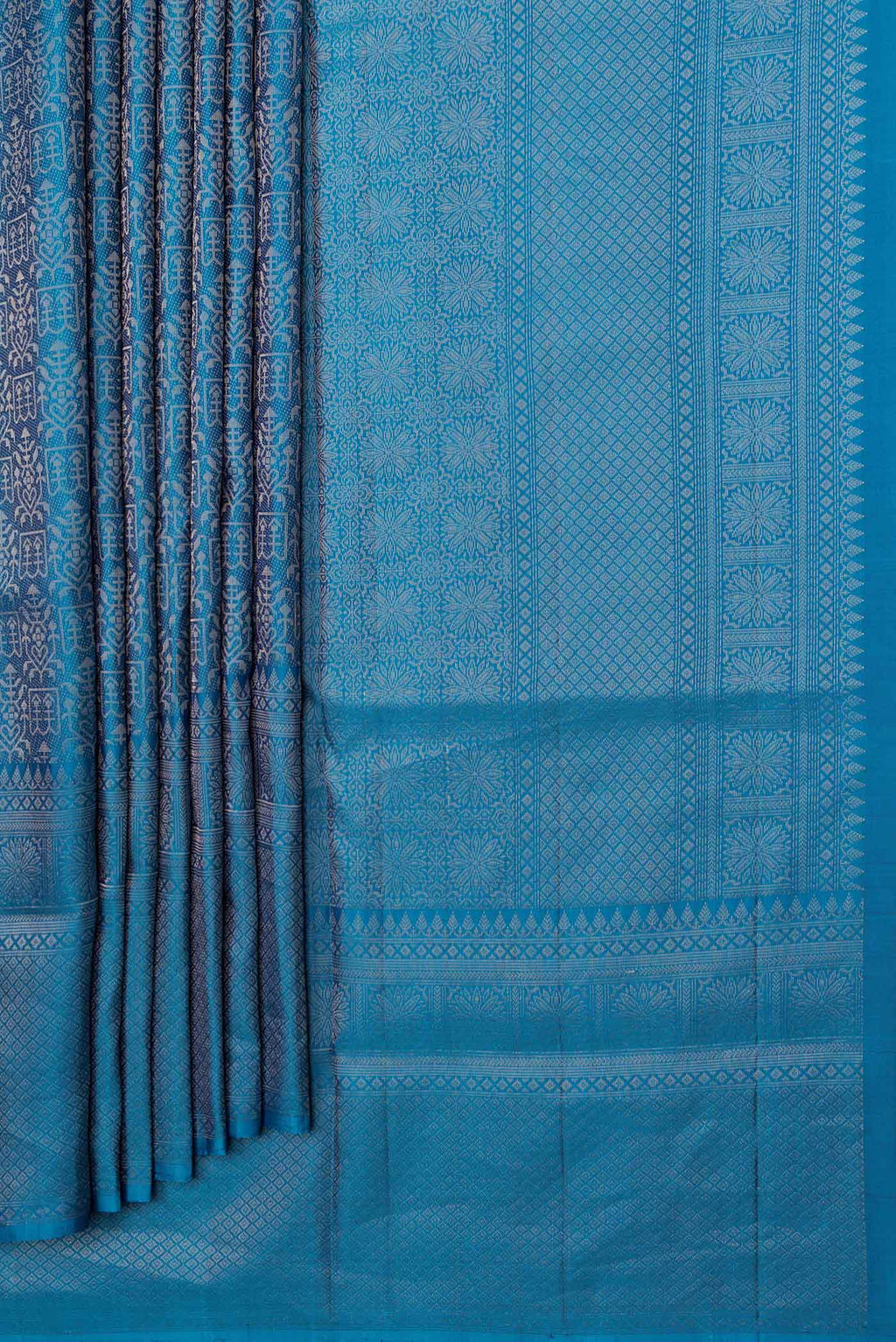 Pleats and pallu of Peacock Blue Dual Tone Soft Silk Saree with Zari Brocade on the body and Zari Border. 