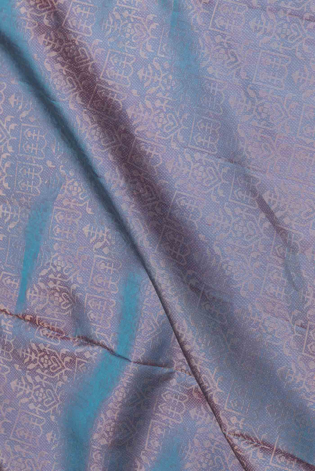 Close up of Peacock Blue Dual Tone Soft Silk Saree with Zari Brocade on the body and Zari Border.  displaying folds