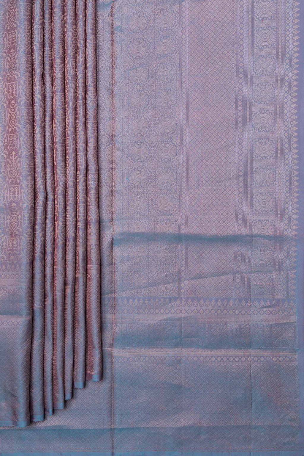 Pleats and pallu of Peacock Blue Dual Tone Soft Silk Saree with Zari Brocade on the body and Zari Border. 