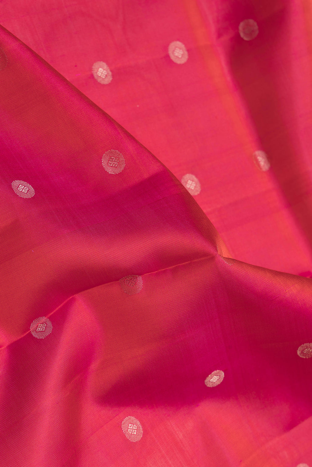 Close up of Dark Pink Dual Tone Soft Silk Saree with Zari Butta on the body and Zari Border.  displaying folds