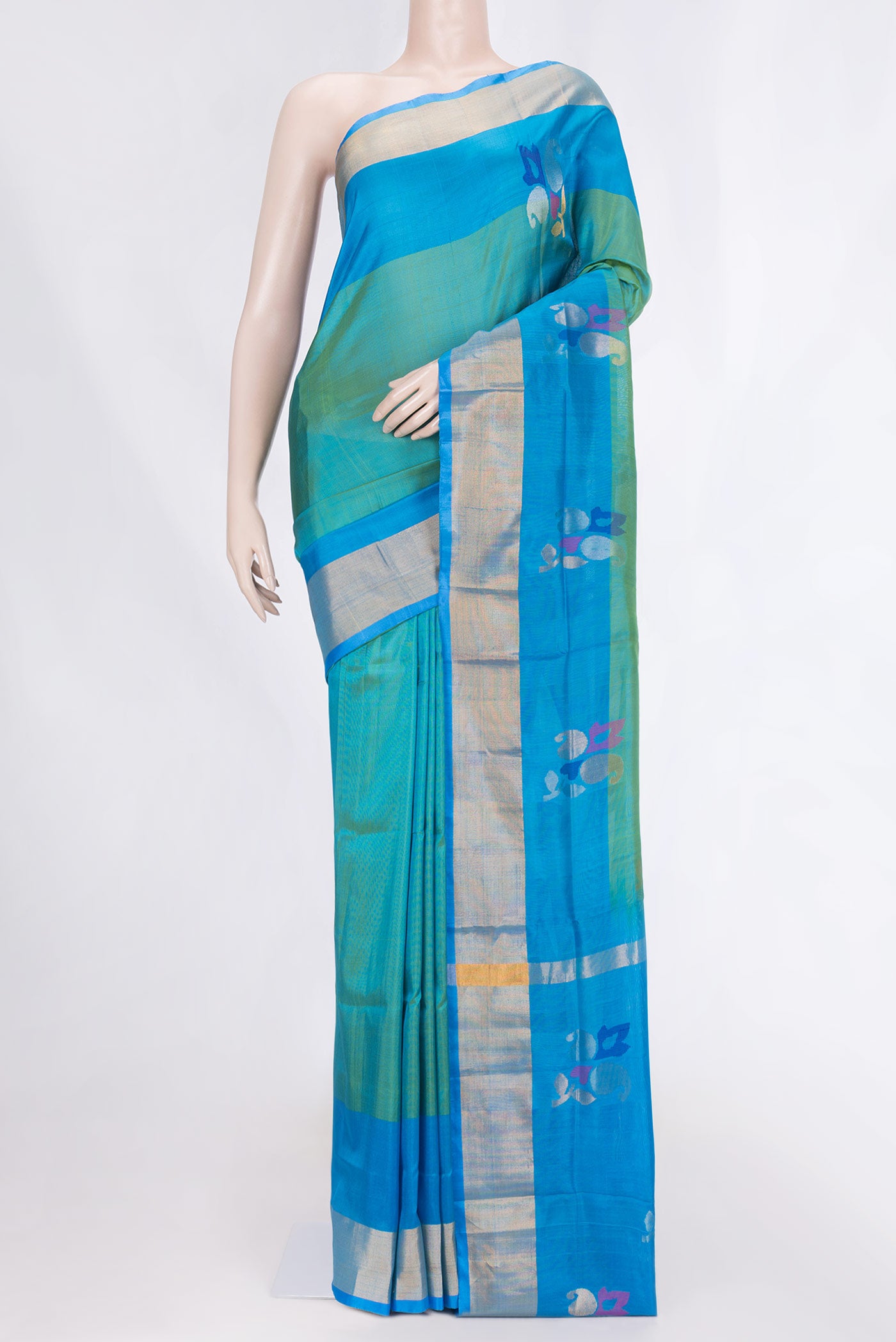 Green with Blue Color Uppada Silk Saree with Zari And Thread Butta on the body and Zari Border displayed on a mannequin