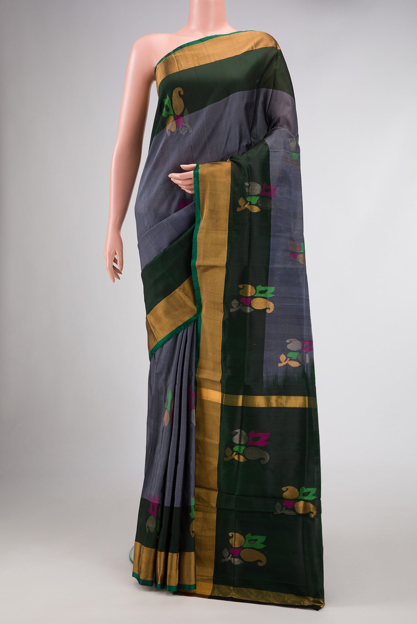 Grey Dual Tone Uppada Silk Saree with Zari And Thread Butta on the body and Zari Border.  displayed on a mannequin