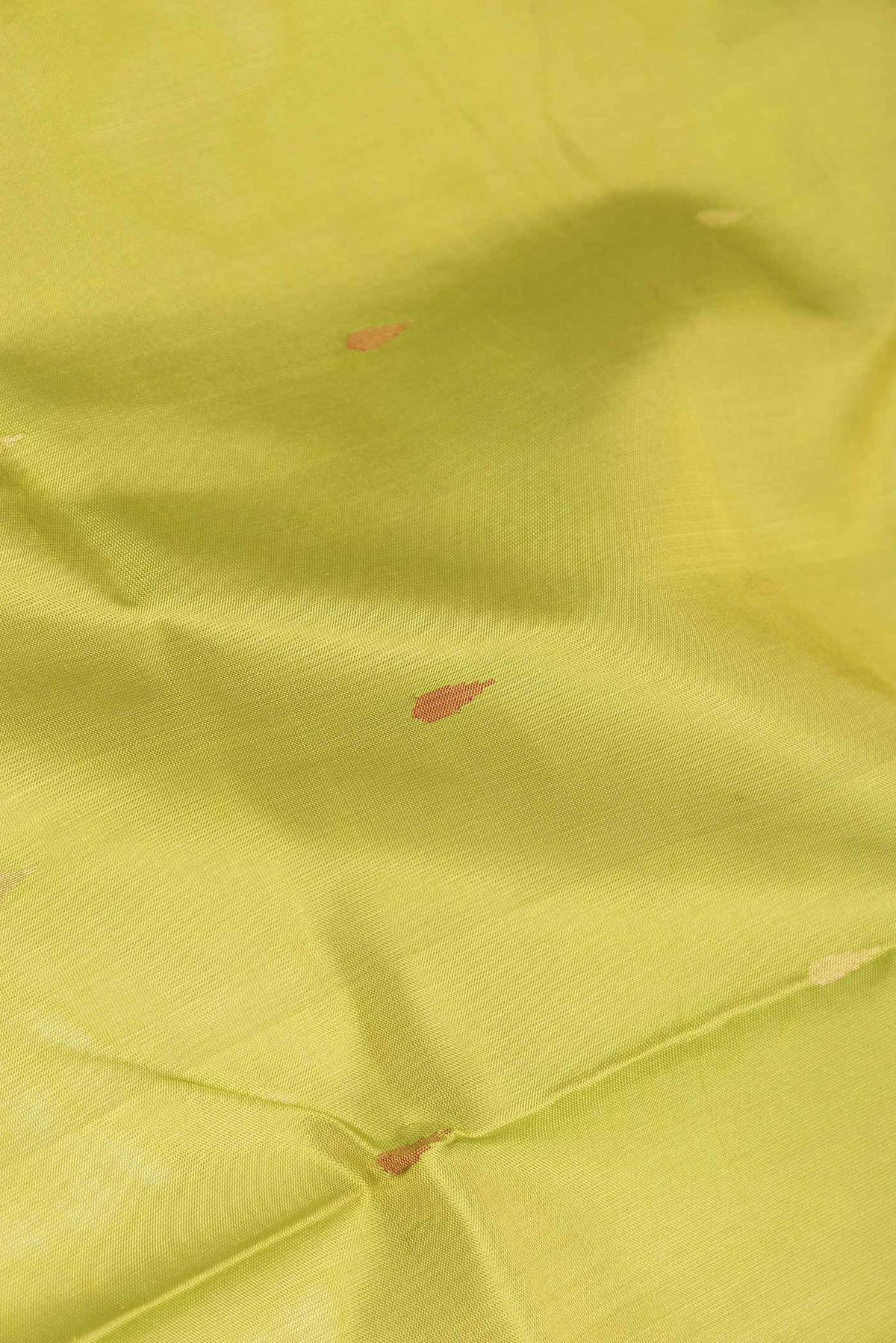 Close up of Parrot Green Dual Tone Uppada Silk Saree with Zari And Thread Butta on the body and Zari Border displaying folds