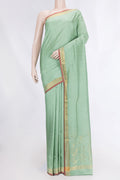 Pista Green Dual Tone Uppada Silk Saree with Zari Butta on the body and Zari Border displayed on a mannequin