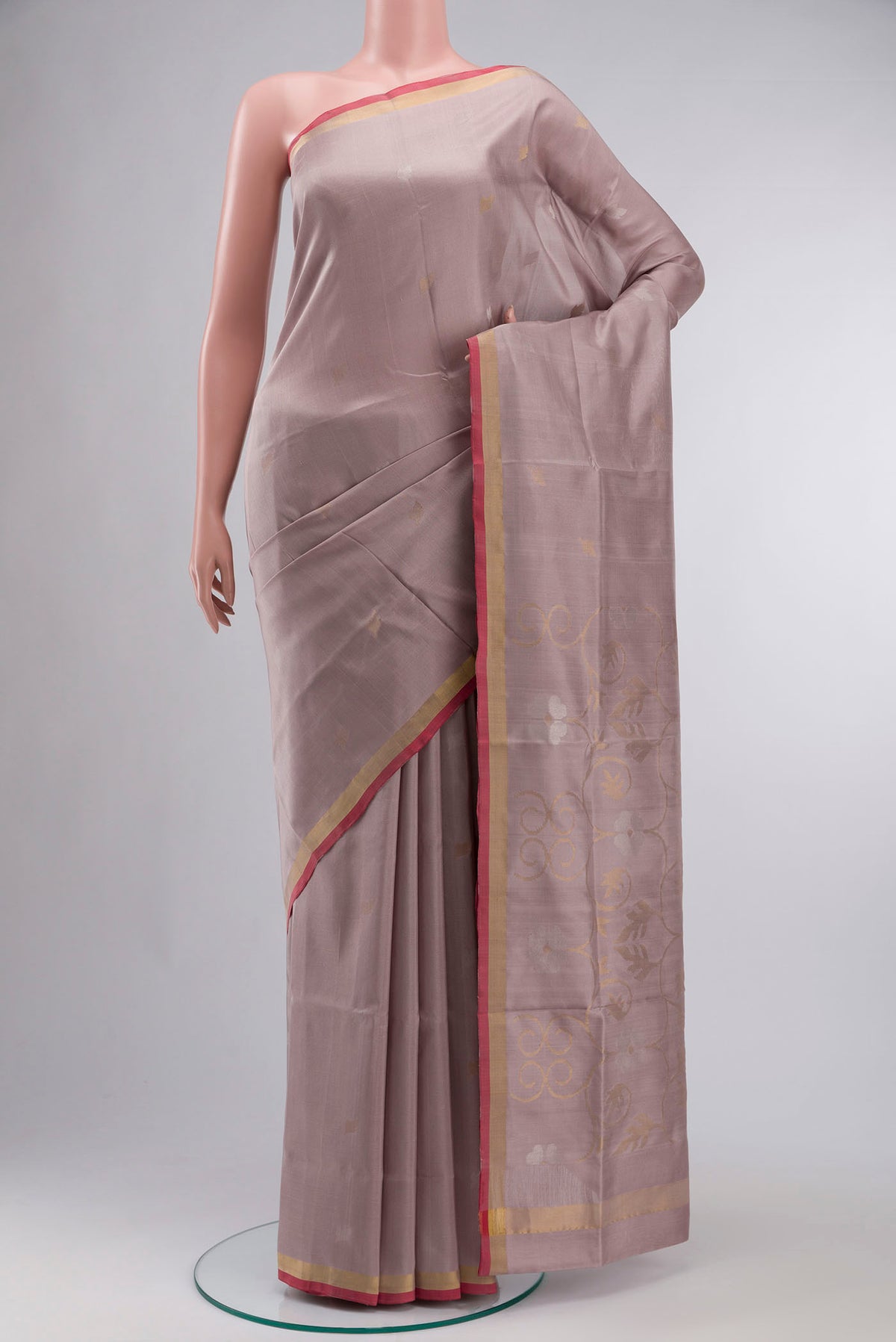 Rose Gold Dual Tone Uppada Silk Saree with Zari Butta on the body and Zari Border displayed on a mannequin