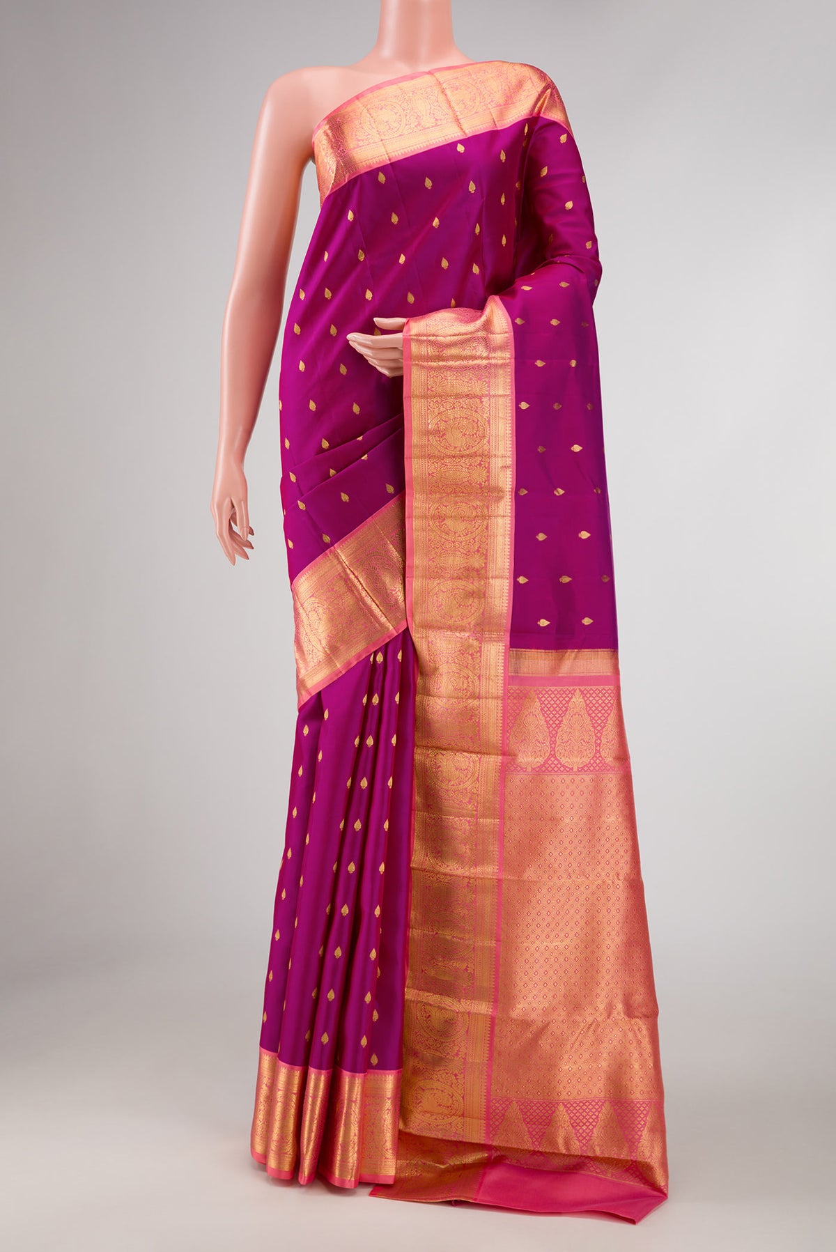 Magenta Dual Tone Kanchipuram Silk Saree with Zari Butta on the body and Zari Border displayed on a mannequin