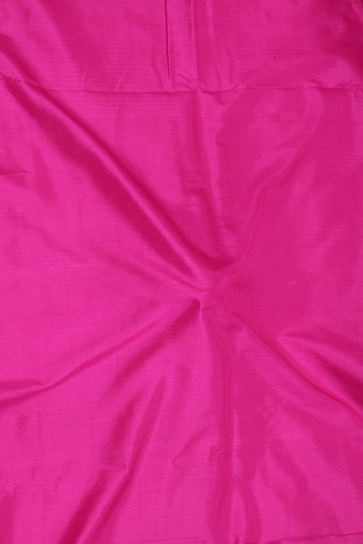 Close up of Dark Pink Dual Tone Pochampally Silk Saree with Plain Body and Zari Border displaying folds