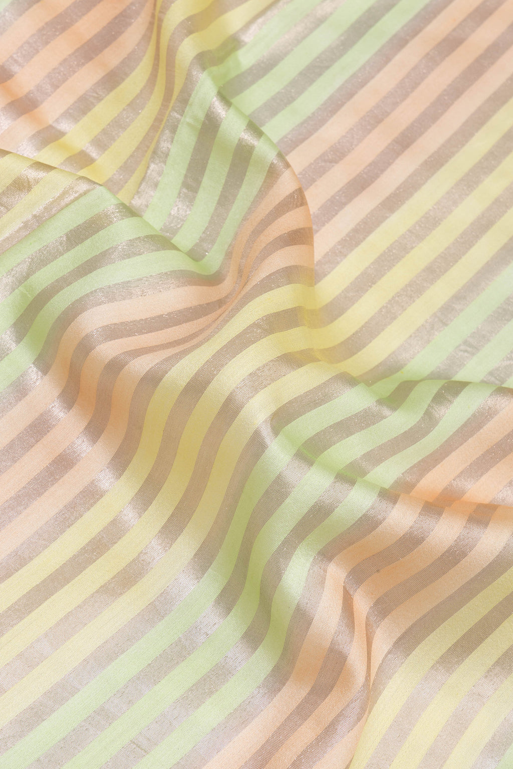 Close up of Multi Color Tussar Silk Saree with Stripes on the body and Zari Border.  displaying folds