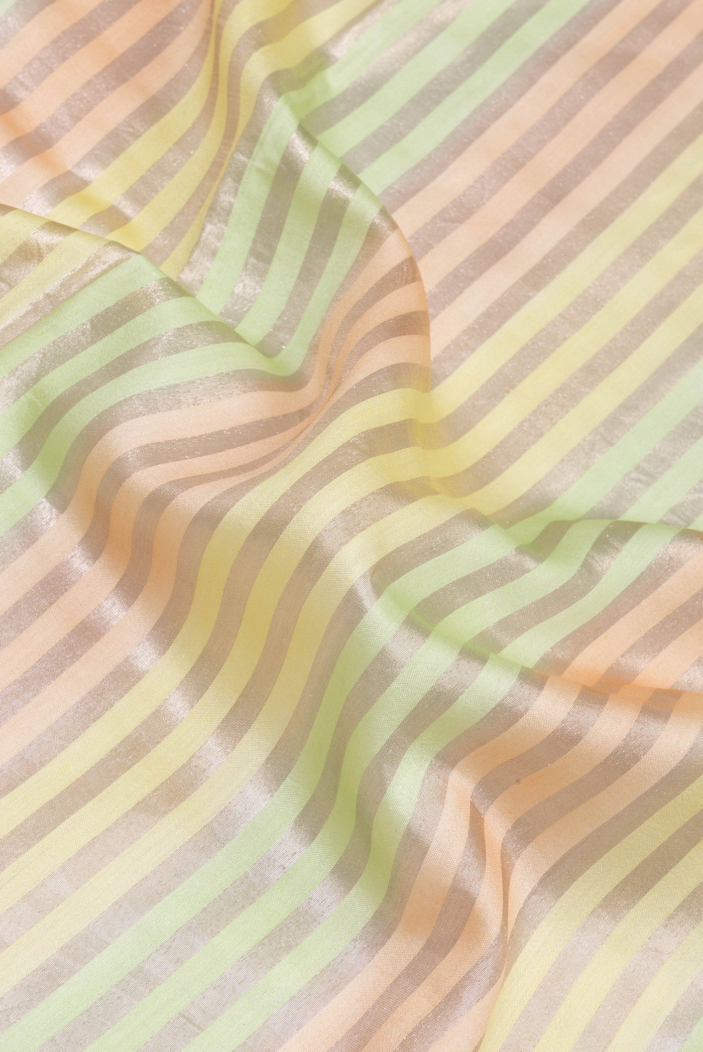 Close up of Multi Color Tussar Silk Saree with Stripes on the body and Zari Border.  displaying folds
