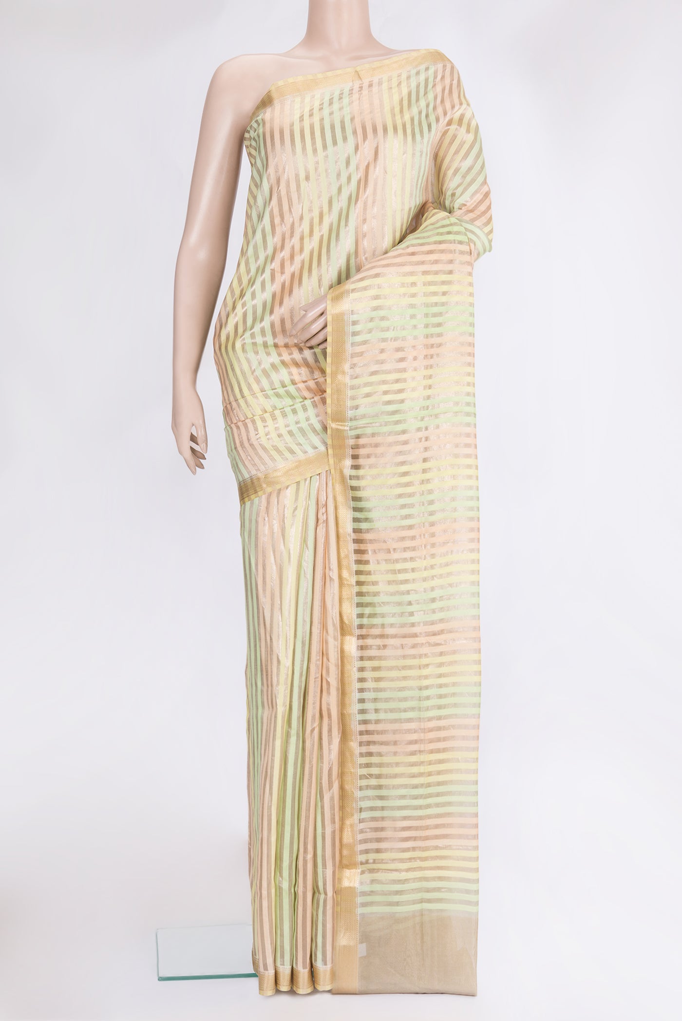 Multi Color Tussar Silk Saree with Stripes on the body and Zari Border.  displayed on a mannequin