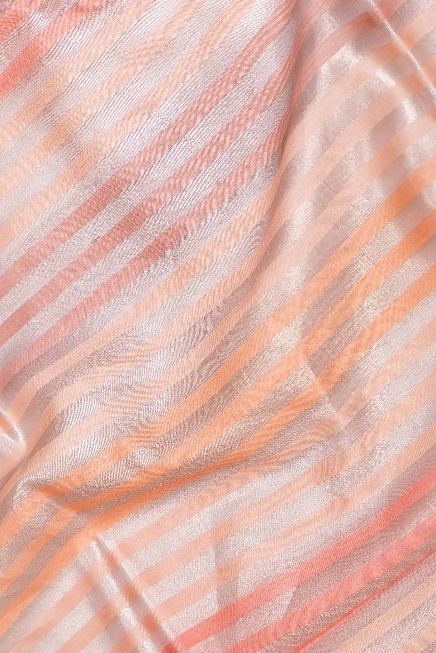 Close up of Golden Peach Dual Tone Banarasi Saree with Stripes on the body and Zari Border displaying folds
