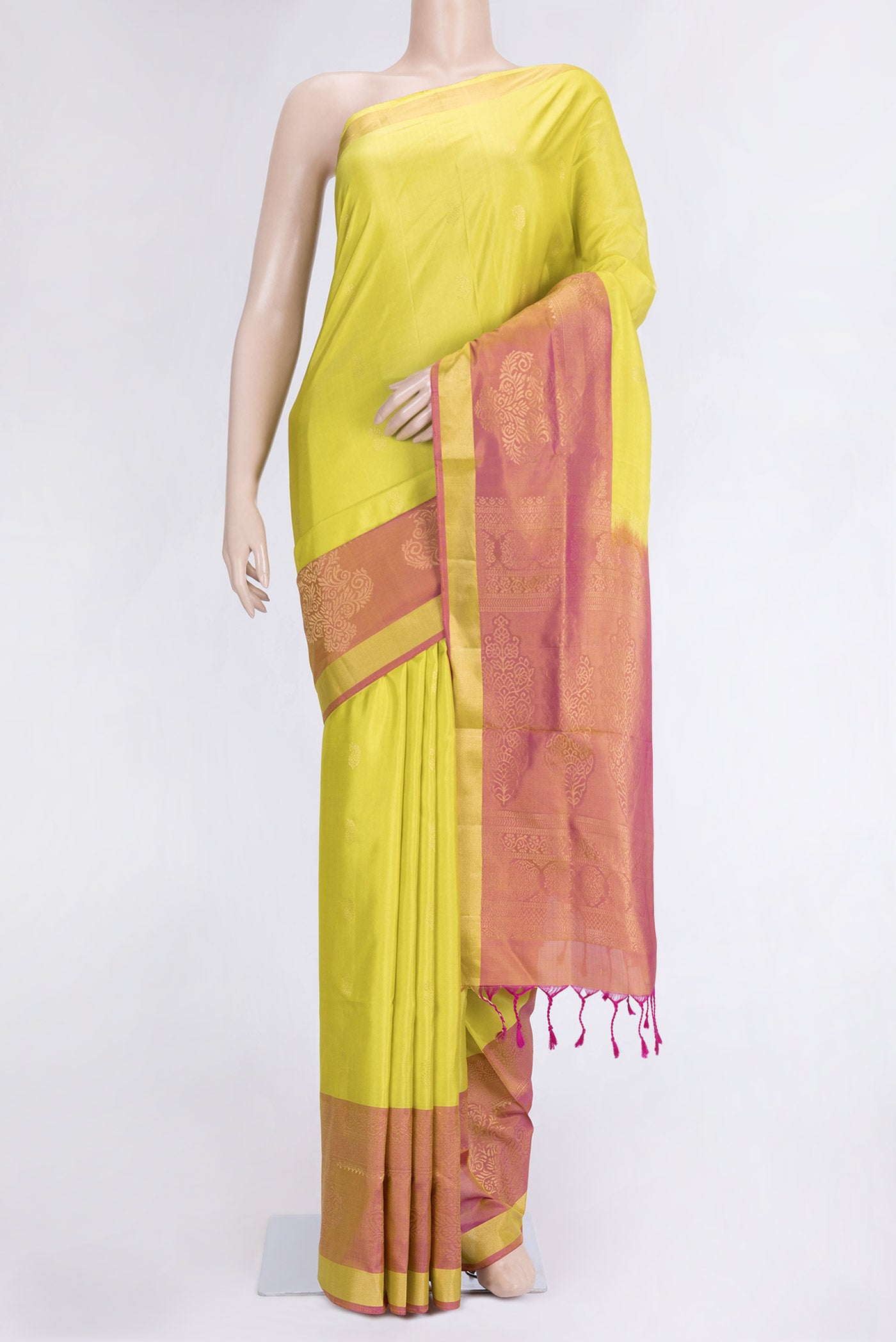 Lemon Yellow Dual Tone Soft Silk Saree with Zari Butta on the body and Fancy Border.  displayed on a mannequin
