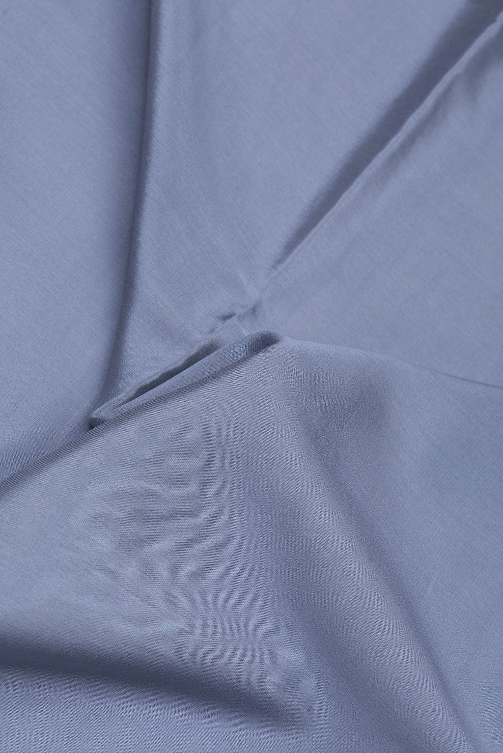 Close up of Grey Mysore Silk Saree with Plain Body and Zari Border.  displaying folds