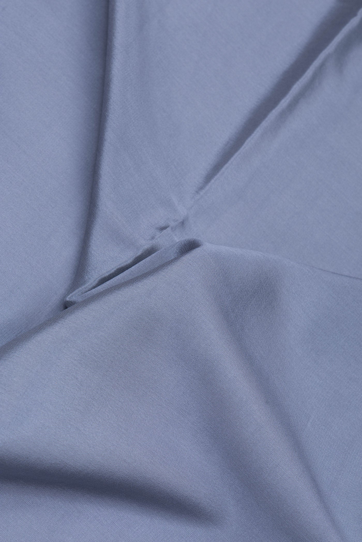 Close up of Grey Mysore Silk Saree with Plain Body and Zari Border.  displaying folds