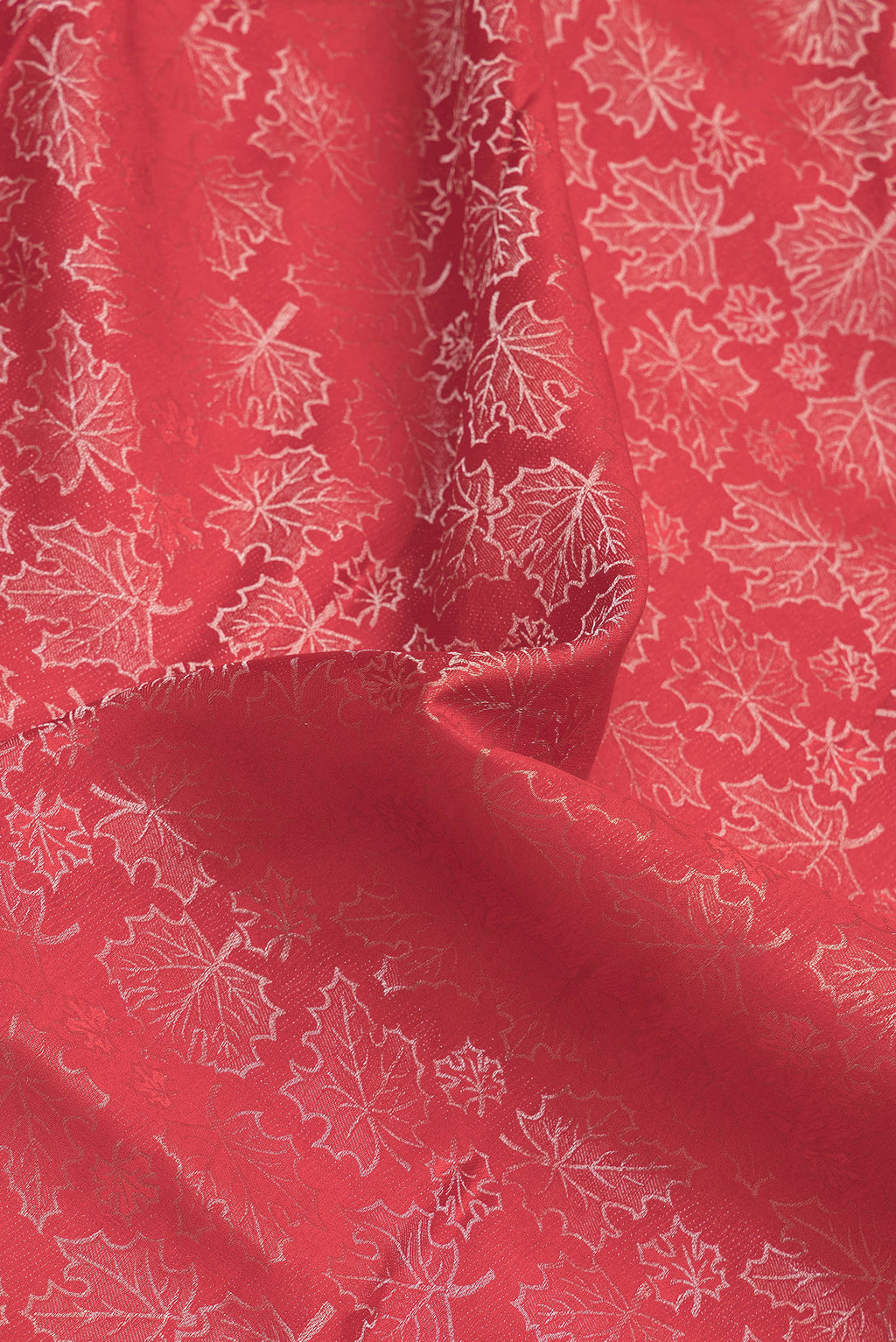 Close up of Red Dual Tone Mysore Silk Saree with Zari Brocade on the body and Zari Border.  displaying folds