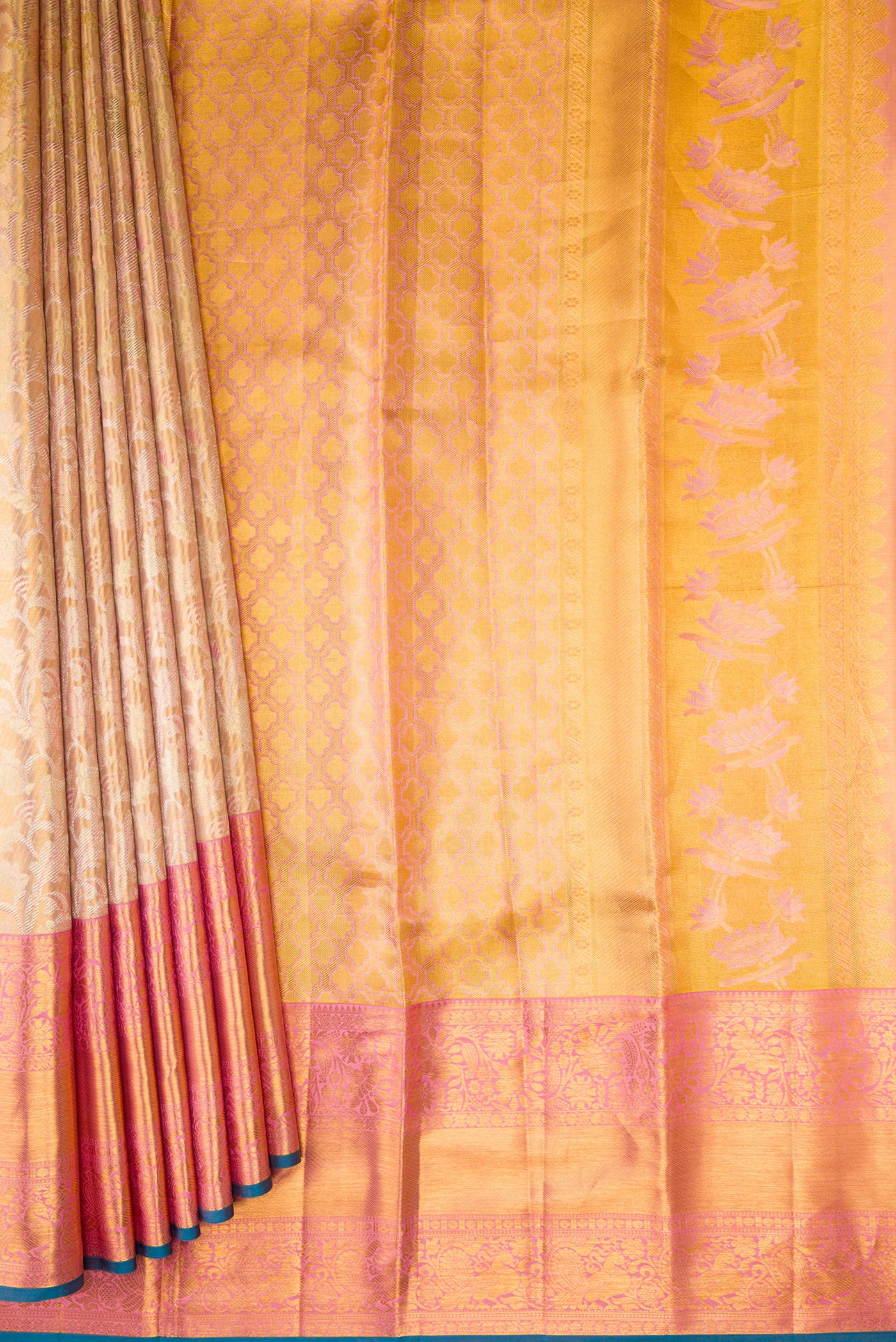 Pleats and pallu of Rose Gold Dual Tone Kanchipuram Tissue Silk Saree with Zari Brocade on the body and Zari Border. 