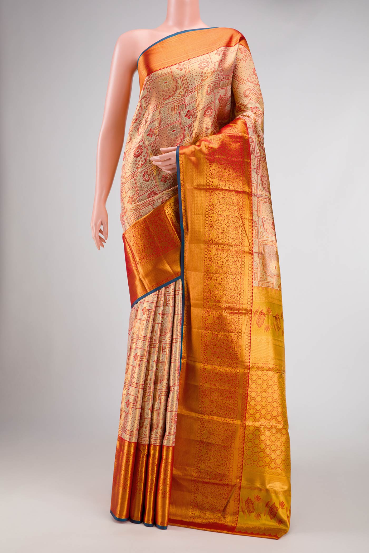 Gold Dual Tone Kanchipuram Tissue Silk Saree with Zari Brocade on the body and Zari Border.  displayed on a mannequin