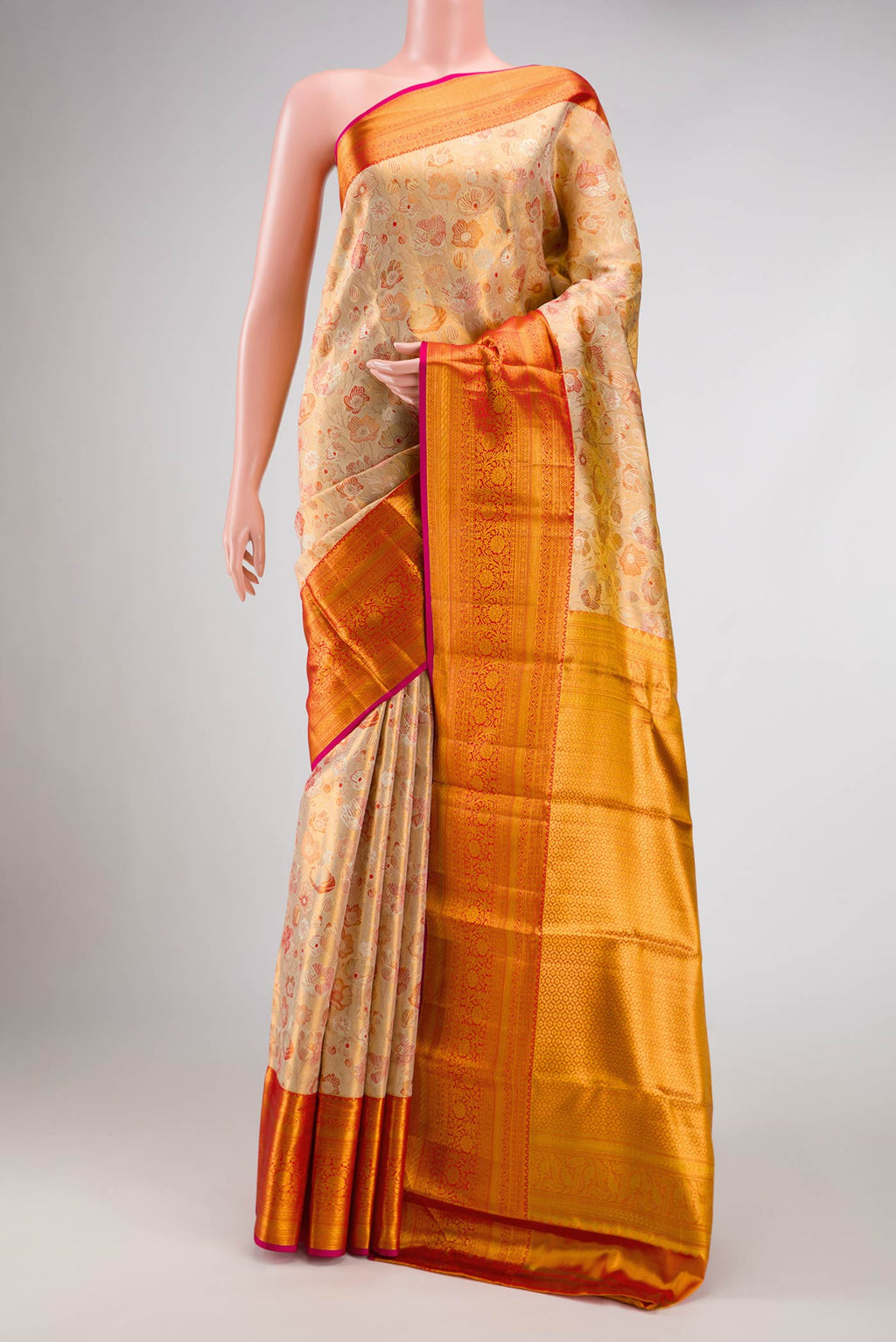 Gold Dual Tone Kanchipuram Tissue Silk Saree with Zari Brocade on the body and Zari Border.  displayed on a mannequin