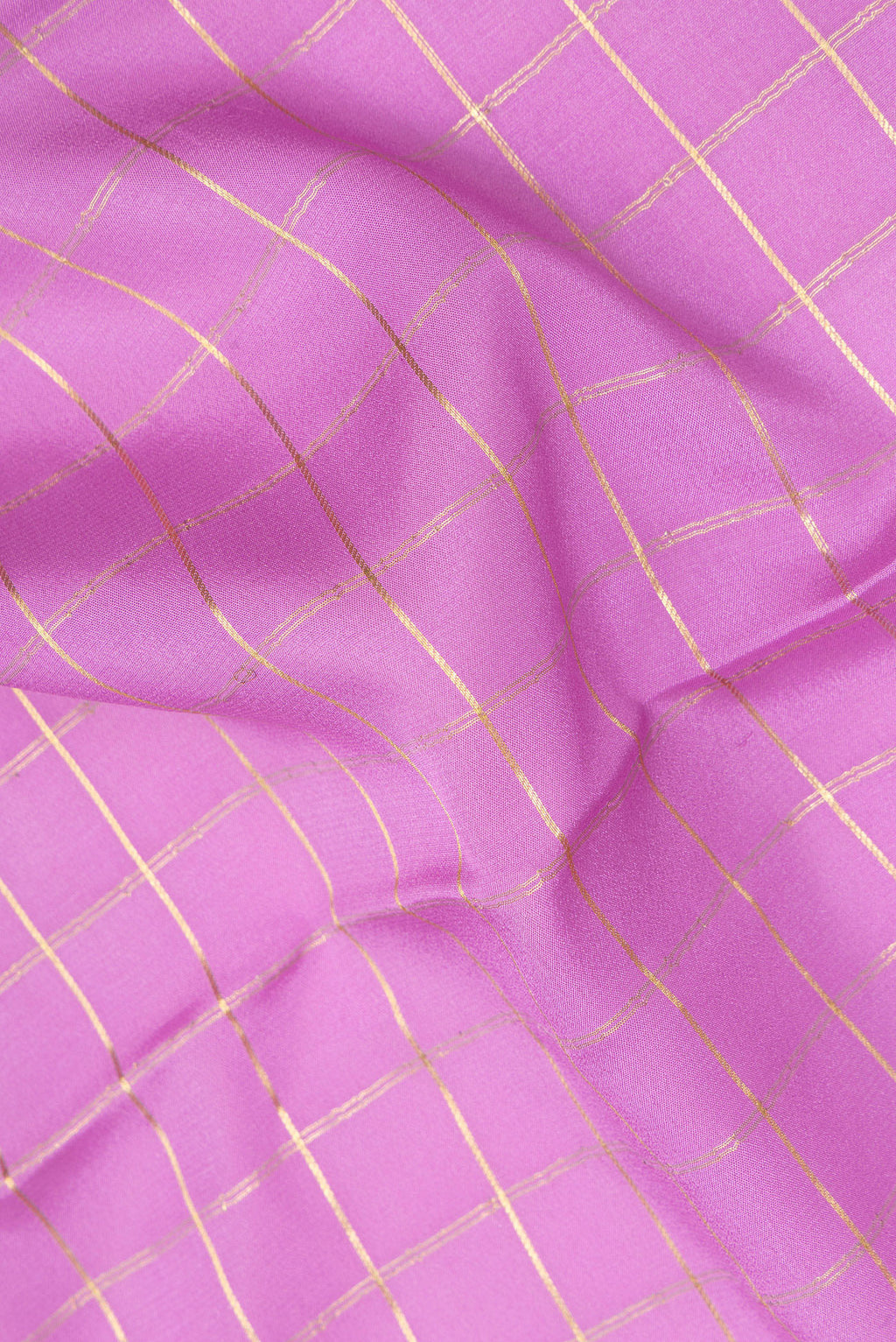 Close up of Lavender Mysore Crepe Saree with Checked design on the body and Zari Border.  displaying folds
