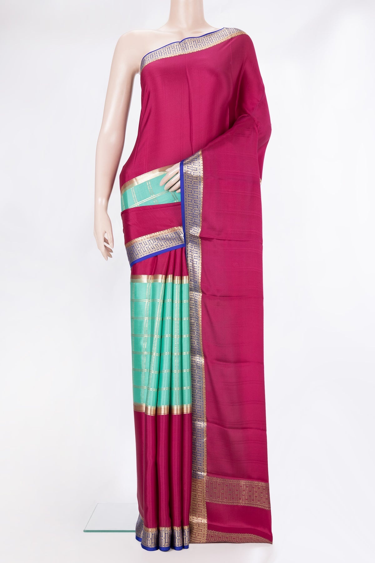 Sea Green Dual Tone Mysore Crepe Saree with Checked design on the body and Zari Border.  displayed on a mannequin