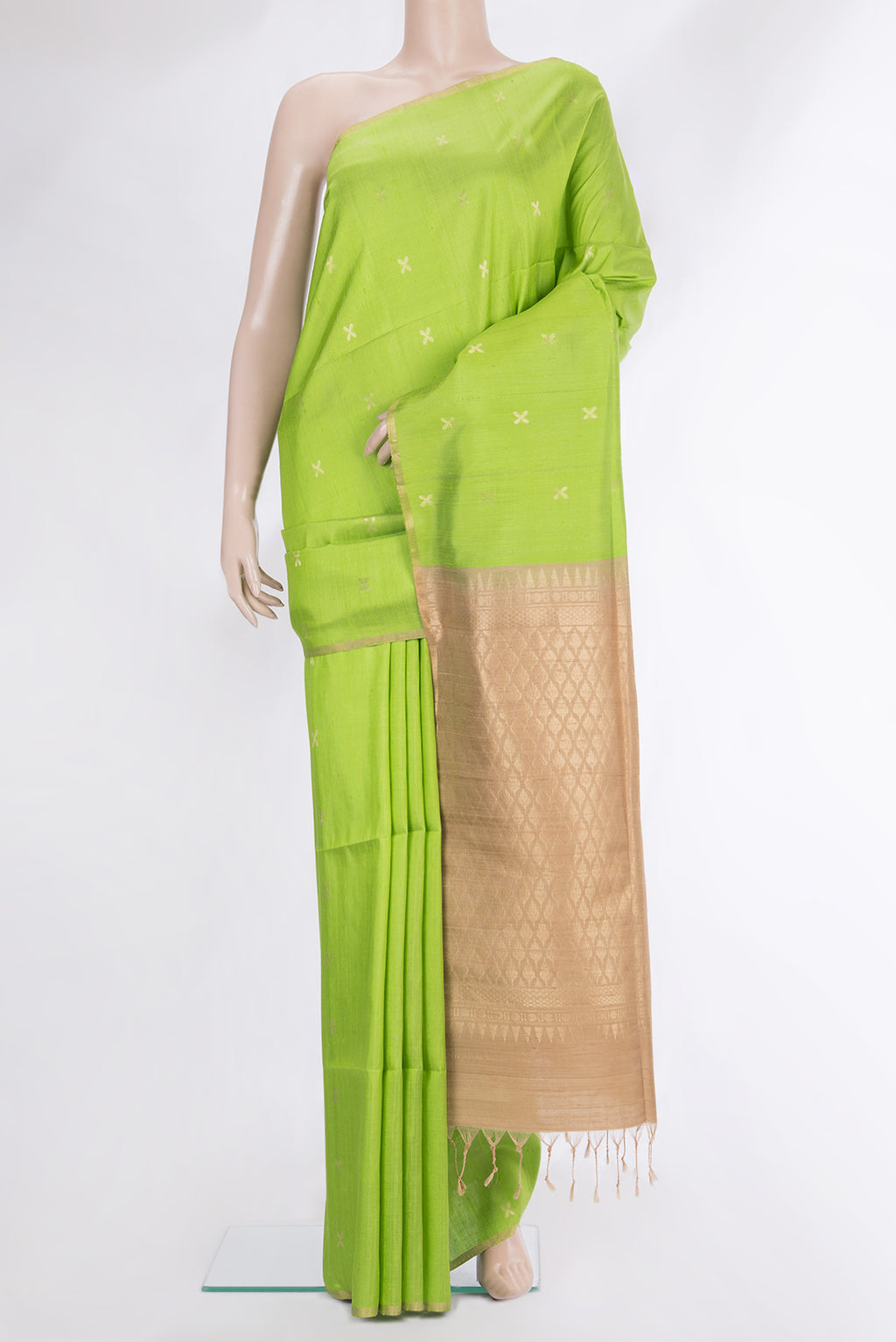 Parrot Green Raw Saree with Zari Butta on the body and Zari Border.  displayed on a mannequin