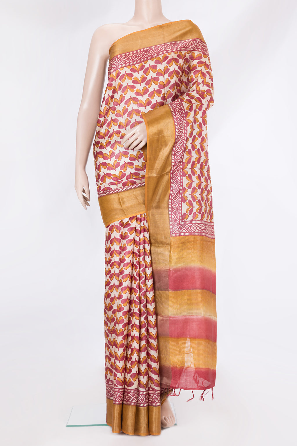 Beige Tussar Silk Saree with Printed design on the body and Zari Border.  displayed on a mannequin