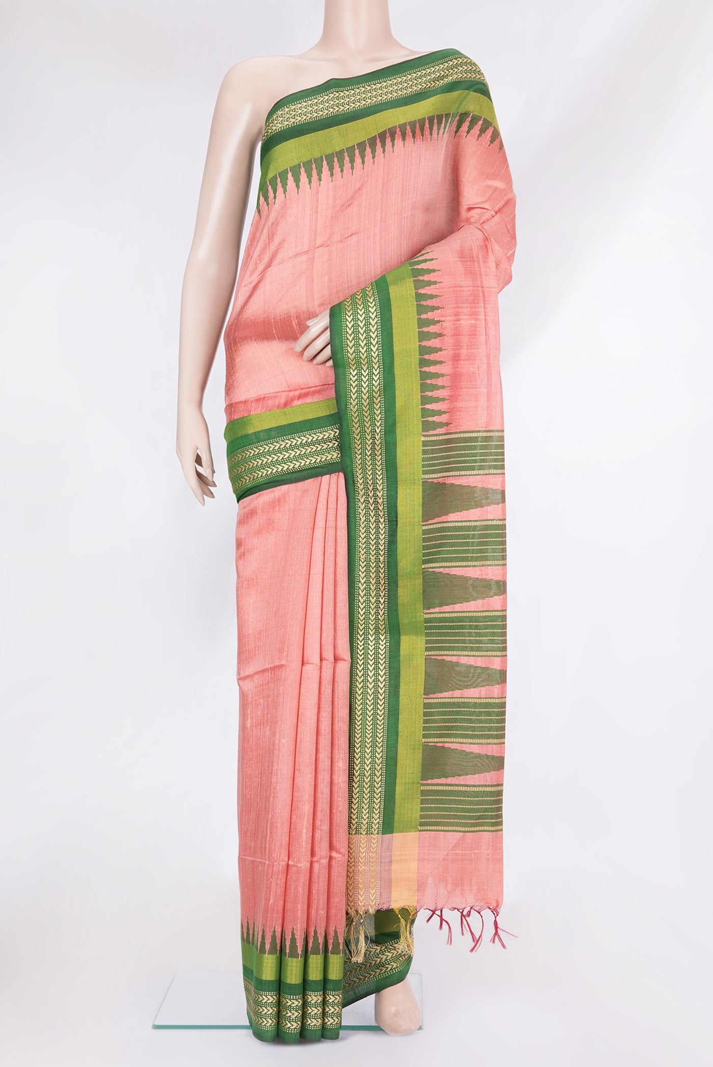 Coral Tussar Silk Saree with Plain Body and Zari Border.  displayed on a mannequin