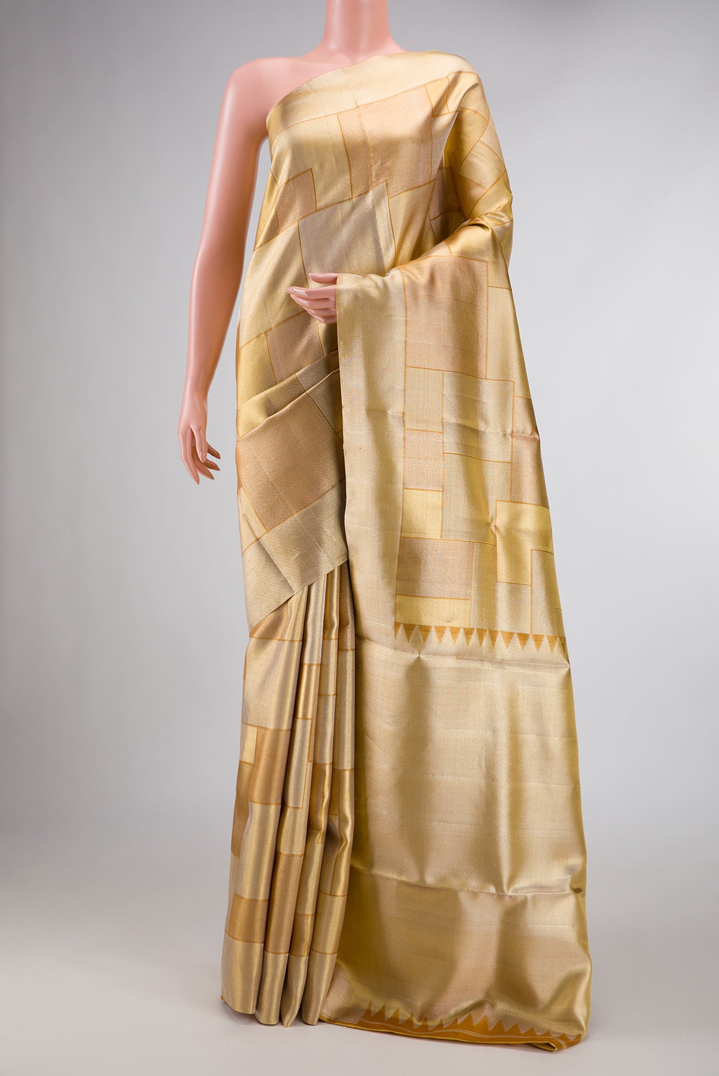 Gold Dual Tone Kanchipuram Silk Saree with Zari Brocade on the body and Zari Border displayed on a mannequin