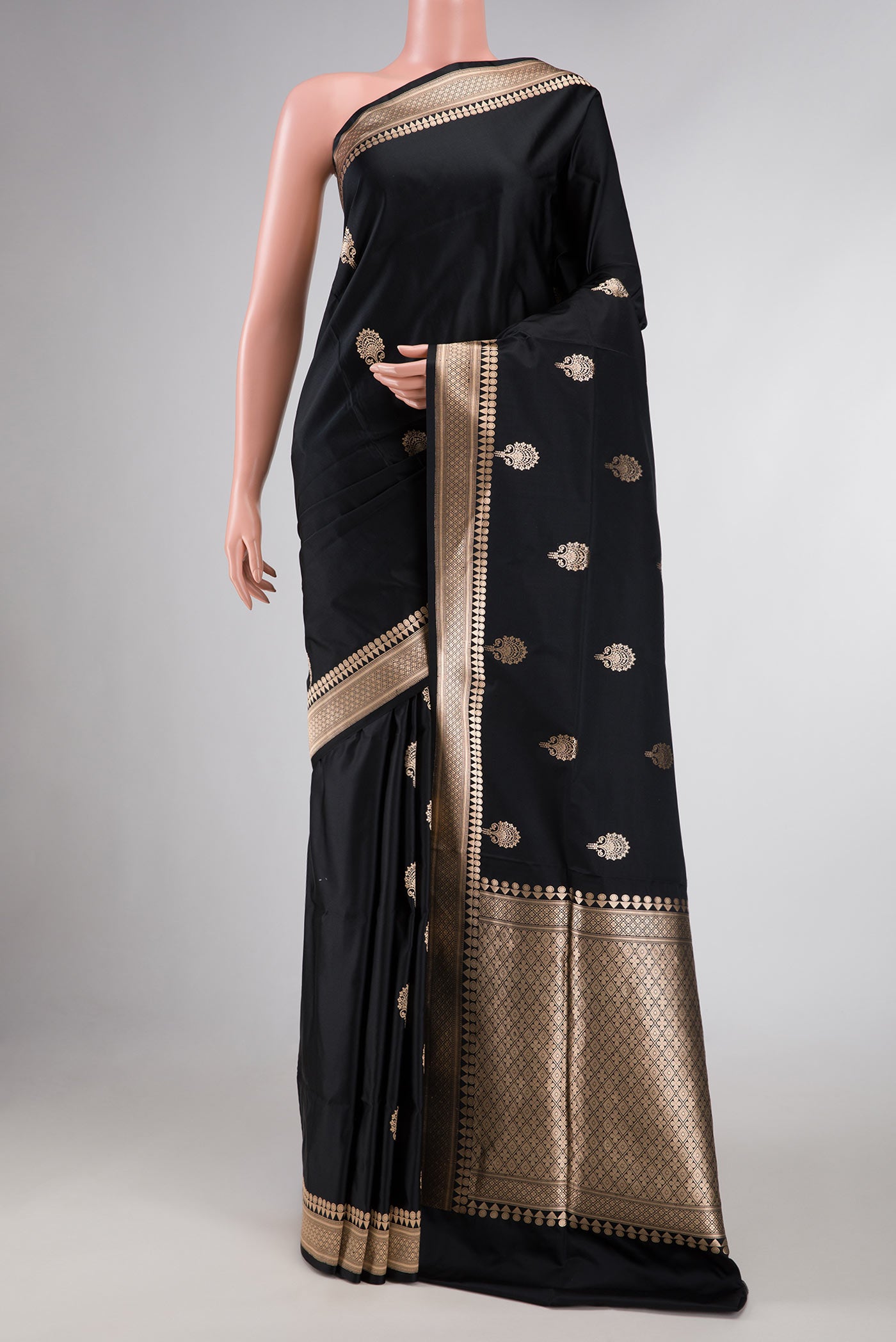 Black Banarasi Silk Saree with Zari Butta on the body and Zari Border displayed on a mannequin