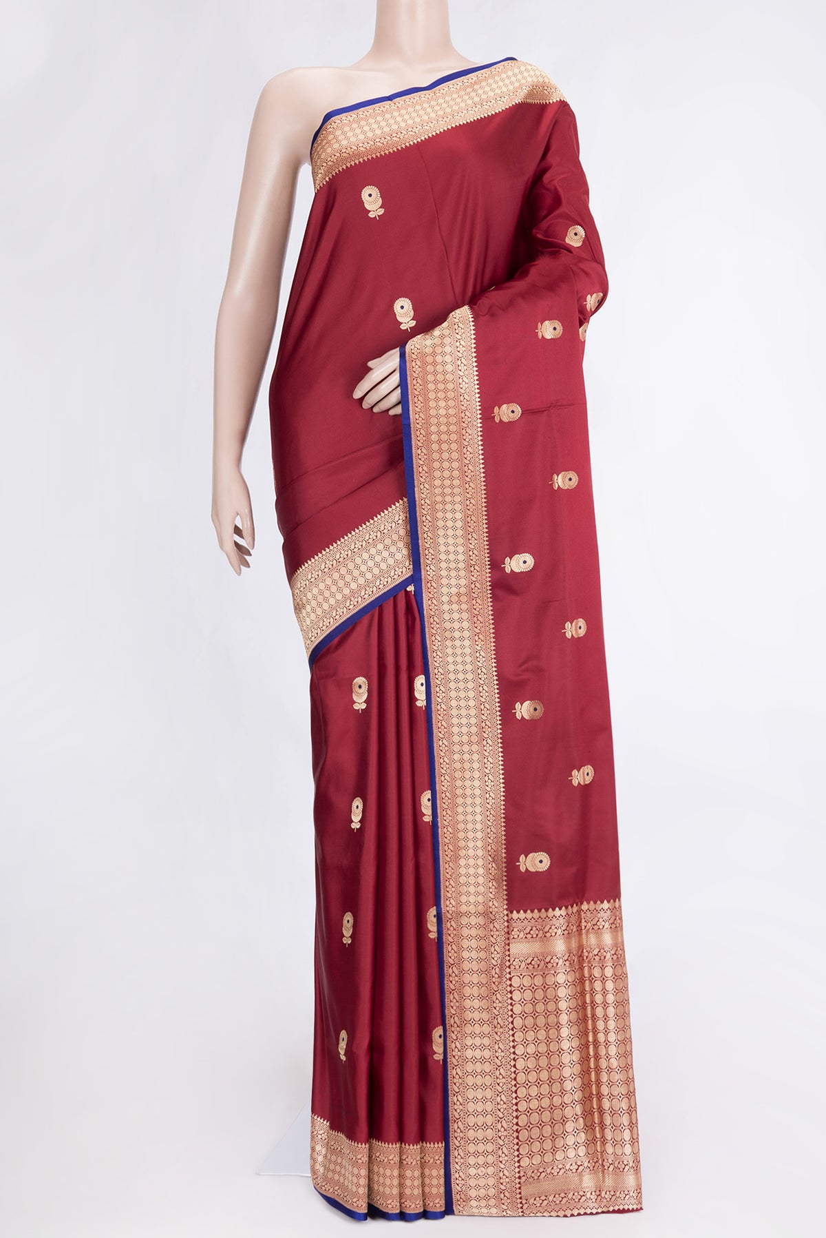Maroon Dual Tone Banarasi Silk Saree with Zari And Thread Butta on the body and Zari Border.  displayed on a mannequin