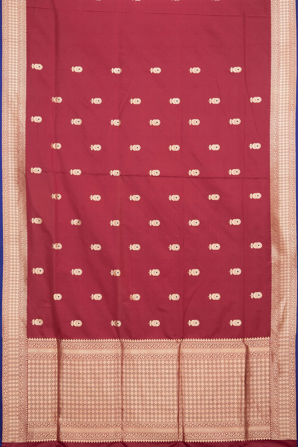 Flat view of Maroon Dual Tone Banarasi Silk Saree with Zari And Thread Butta on the body and Zari Border. 
