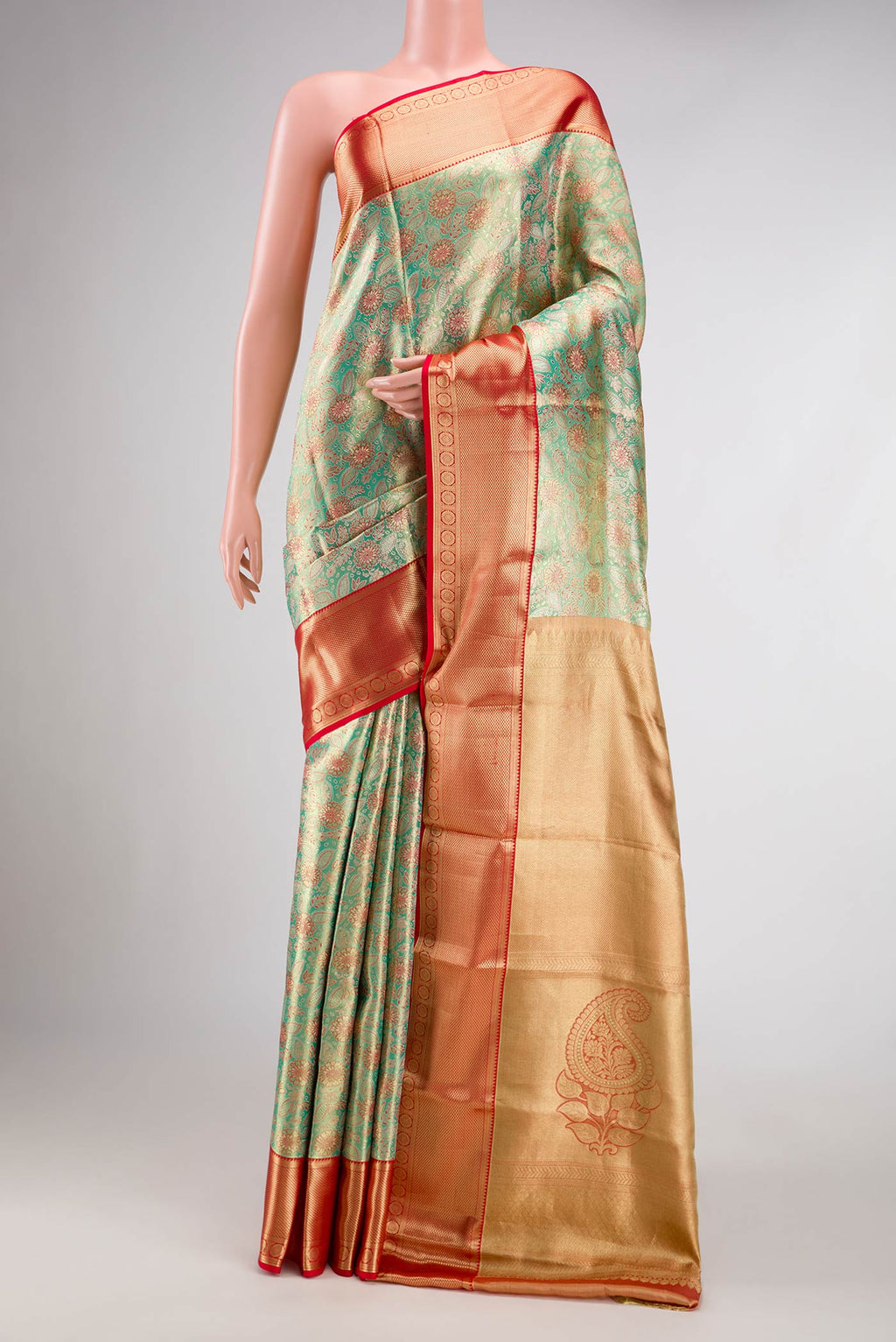 Green Dual Tone Kanchipuram Tissue Silk Saree with Zari Brocade on the body and Zari Border.  displayed on a mannequin