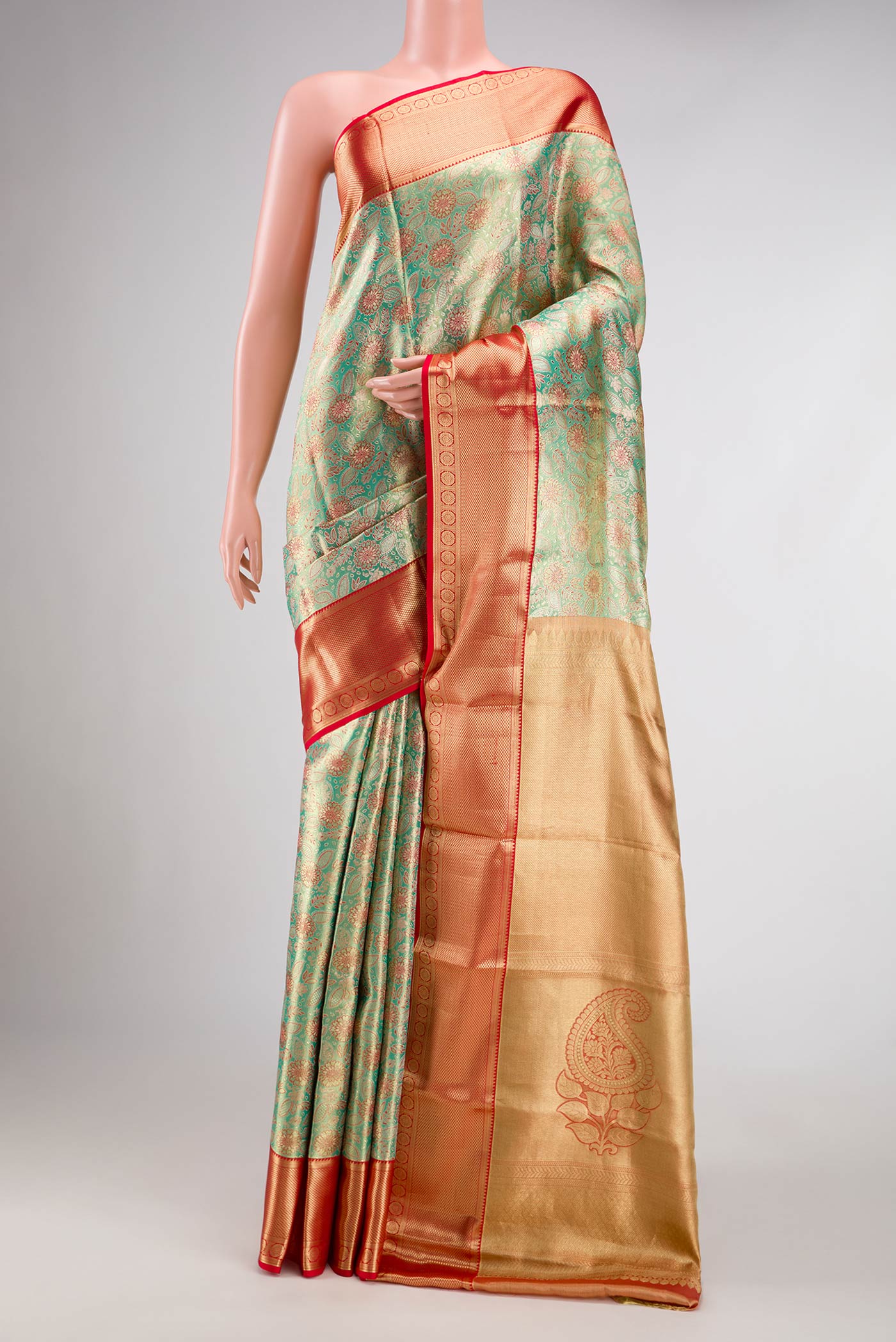 Green Dual Tone Kanchipuram Tissue Silk Saree with Zari Brocade on the body and Zari Border.  displayed on a mannequin