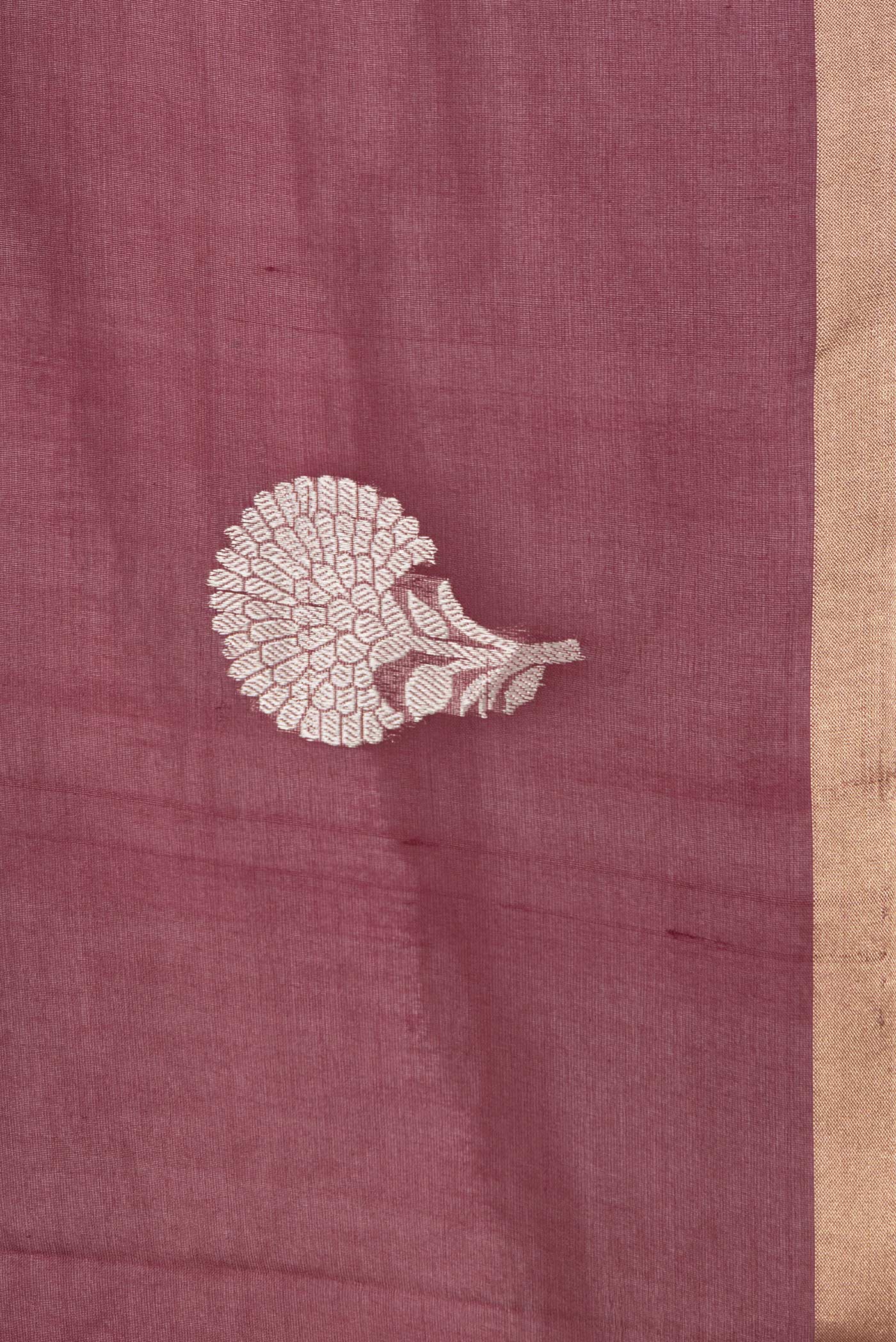 Border image of Maroon Dual Tone Organza Silk Saree with Zari Butta on the body and Thin Zari Line. 