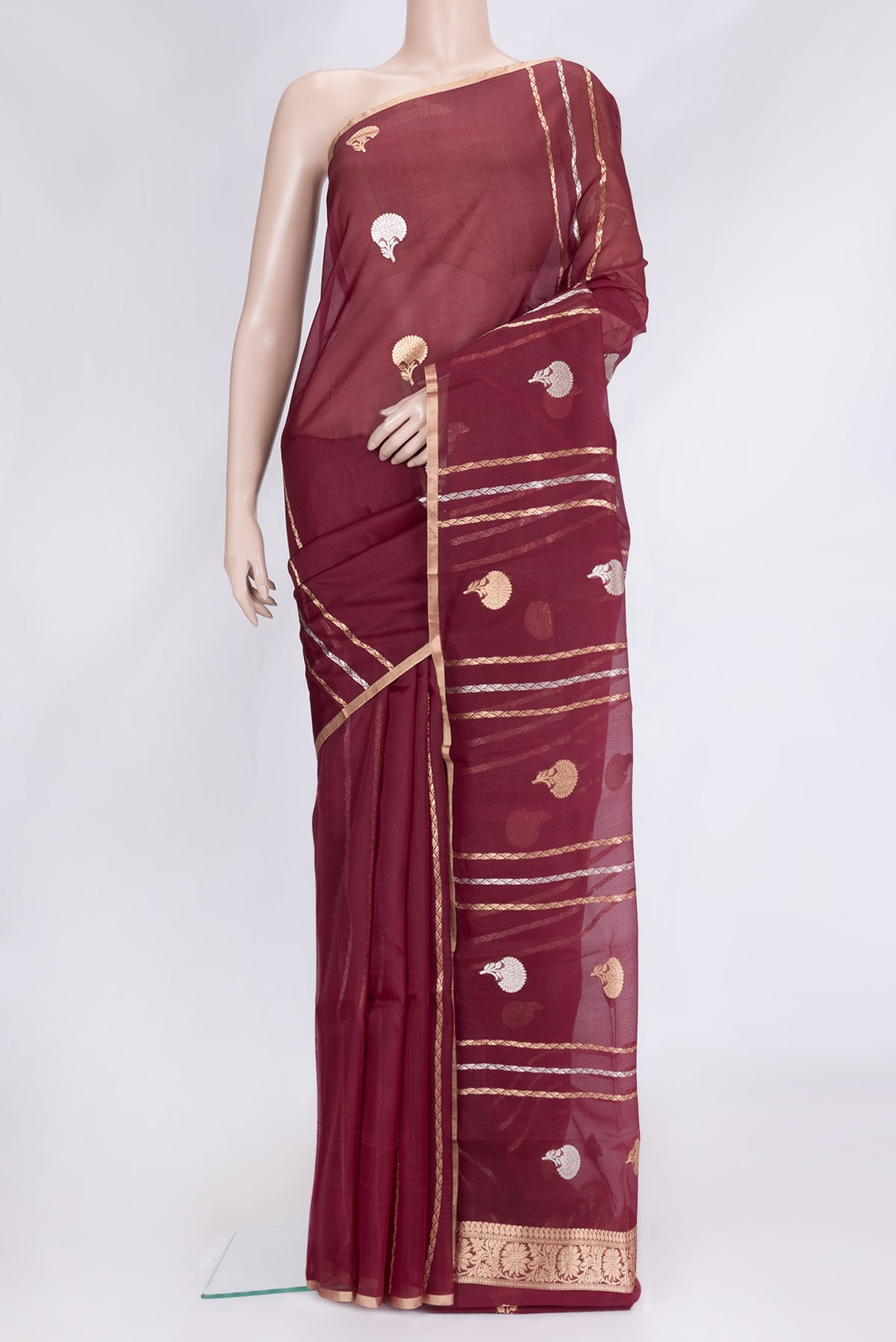 Maroon Dual Tone Organza Silk Saree with Zari Butta on the body and Thin Zari Line.  displayed on a mannequin