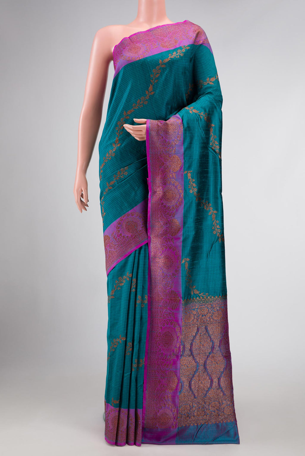 Maya Blue Banarasi Tussar Silk Saree with Zari Butta on the body and Zari Border displayed on a mannequin