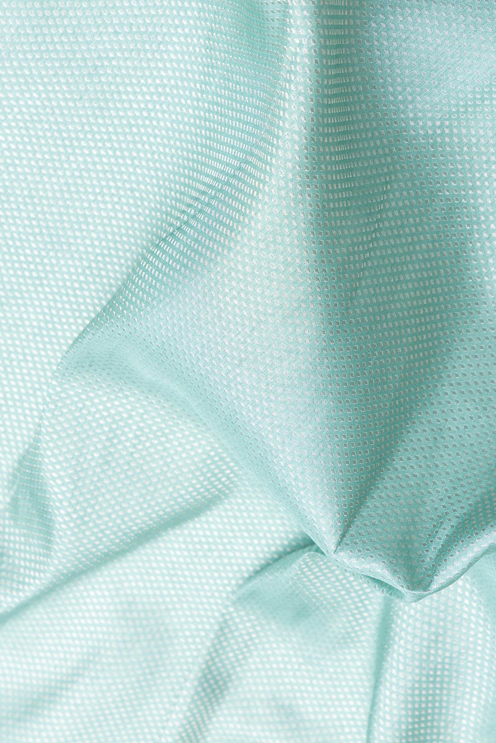 Close up of Sky Blue Dual Tone Banarasi Silk Saree with Zari Brocade on the body and Embroidery Border.  displaying folds