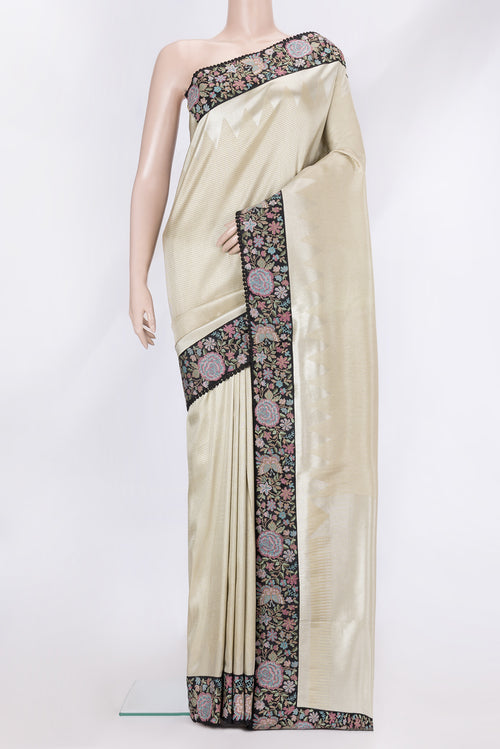 Beige Dual Tone Banarasi Silk Saree with Zari Brocade on the body and Embroidery Border.  displayed on a mannequin