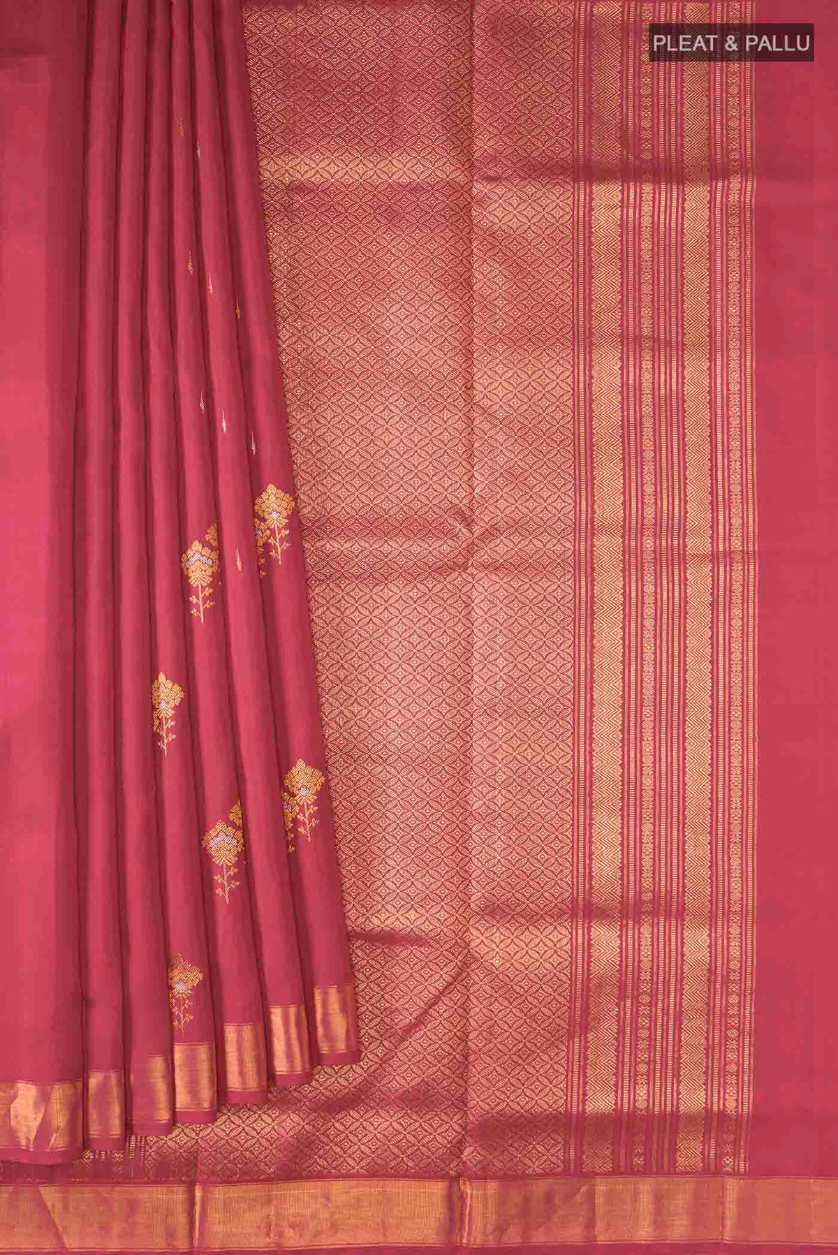 Pleats and pallu of Red Kanchipuram Silk Saree with Zari Butta on the body and Zari Border