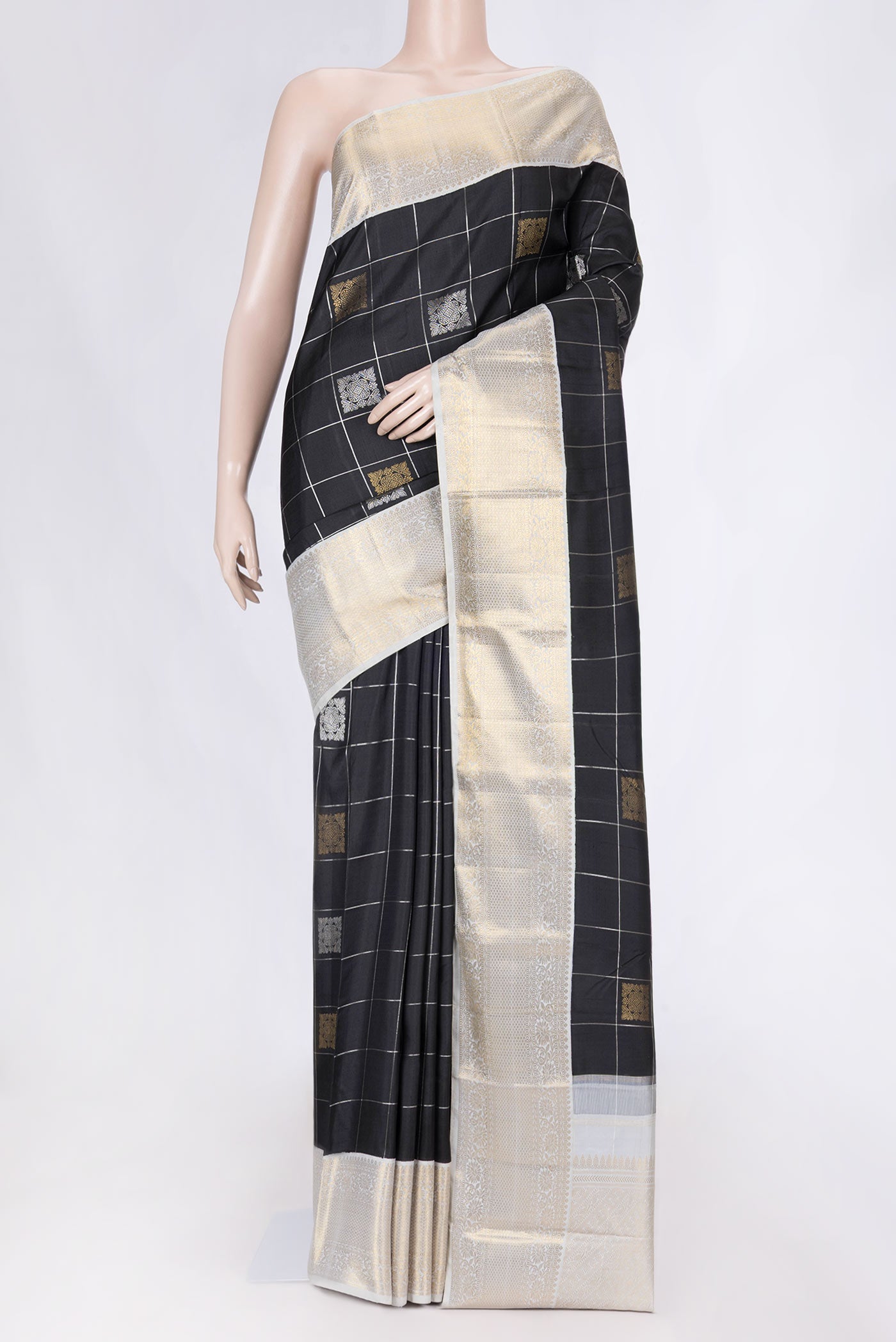 Pure Silk Pure Zari Black Dual Tone Kanchipuram Saree with Checked design on the body and Zari Border displayed on a mannequin