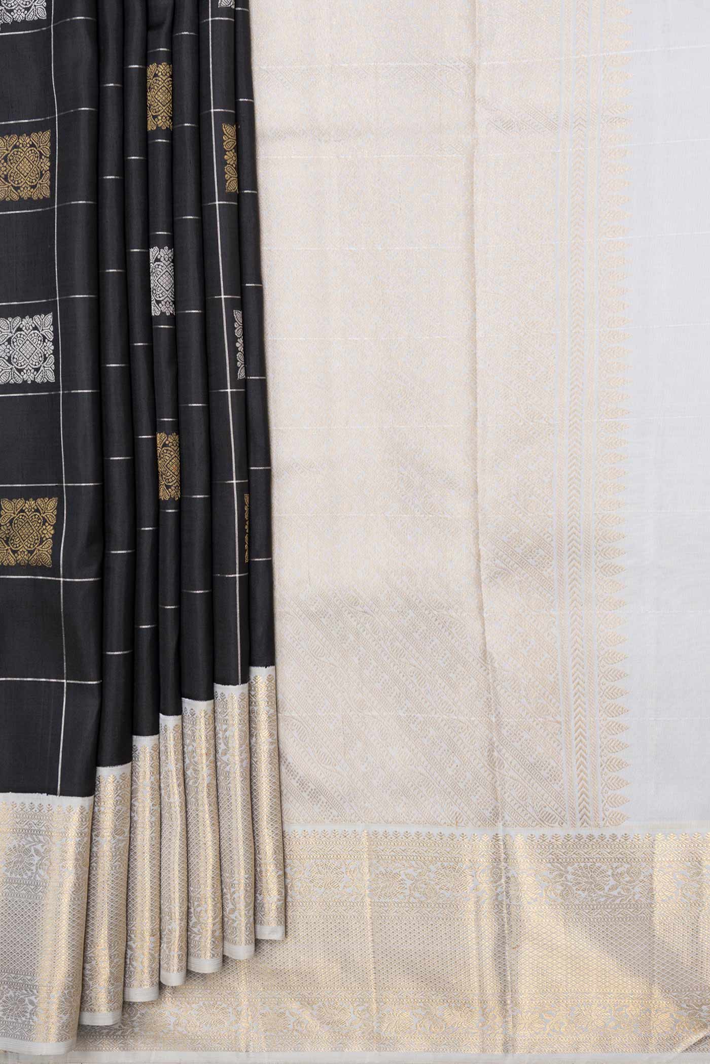 Pleats and pallu of Pure Silk Pure Zari Black Dual Tone Kanchipuram Saree with Checked design on the body and Zari Border