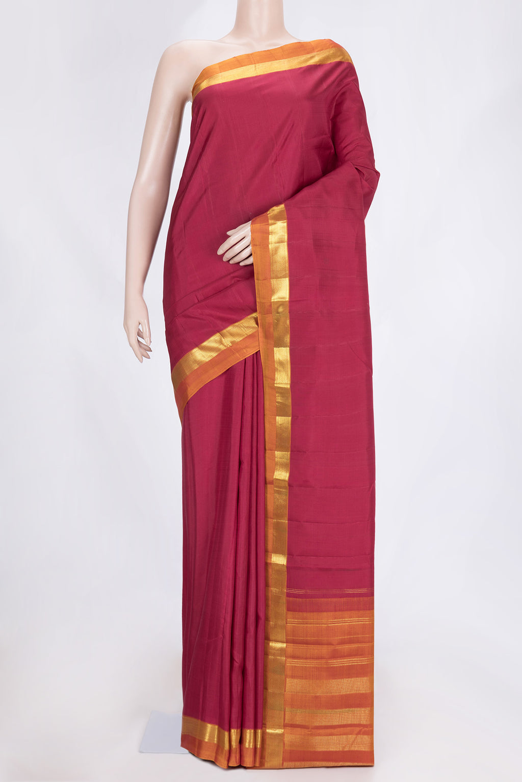 Maroon Dual Tone Kanjivaram Saree with Plain Body and Zari Border.  displayed on a mannequin