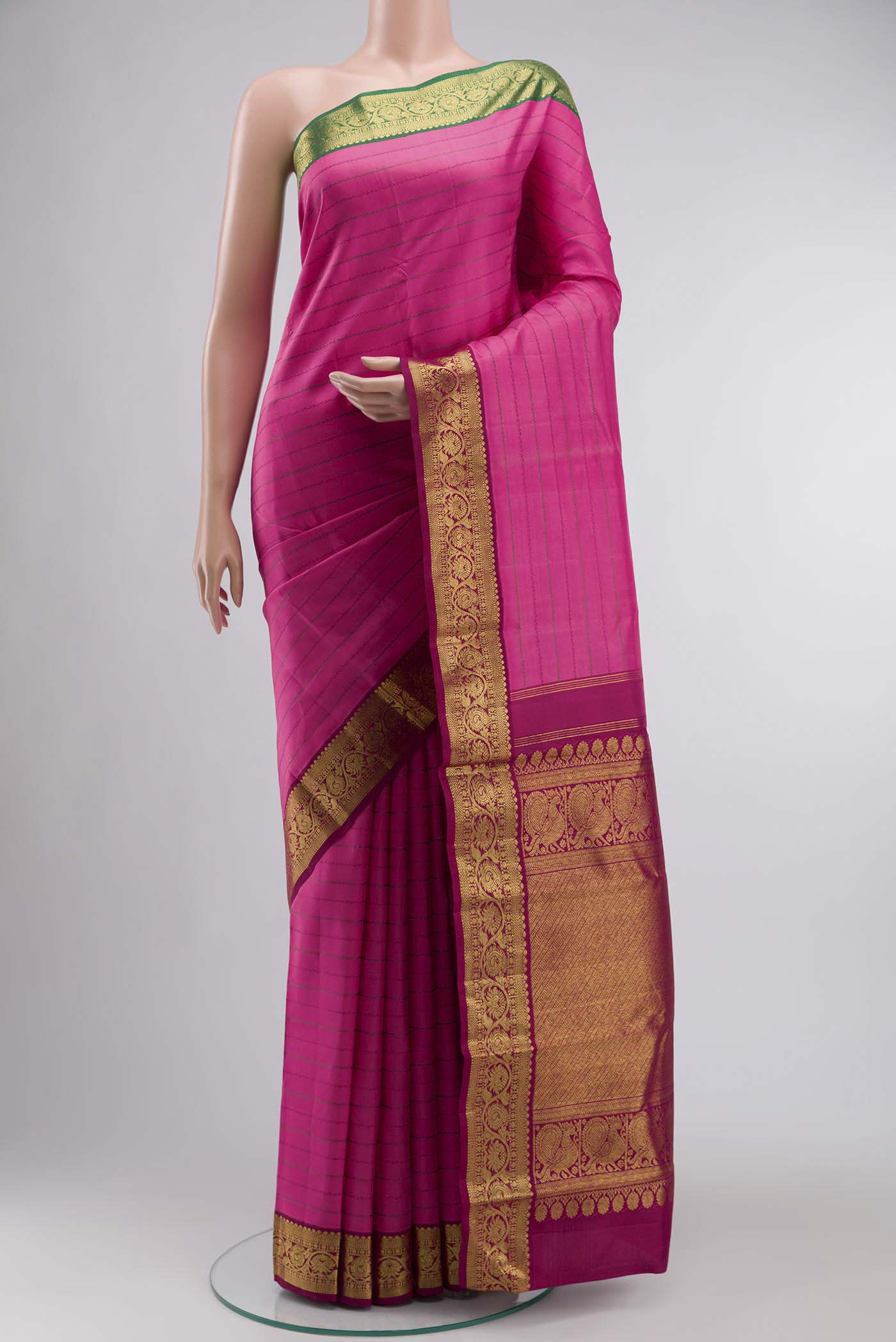 Pink Kanchipuram Silk Saree with Stripes on the body and Zari Border displayed on a mannequin