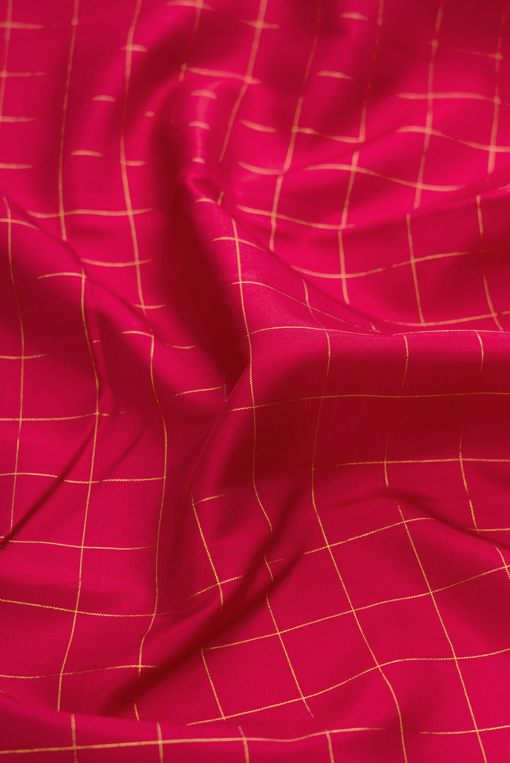 Close up of Maroon Kanchipuram Silk Saree with Checked design on the body and Fancy Border.  displaying folds