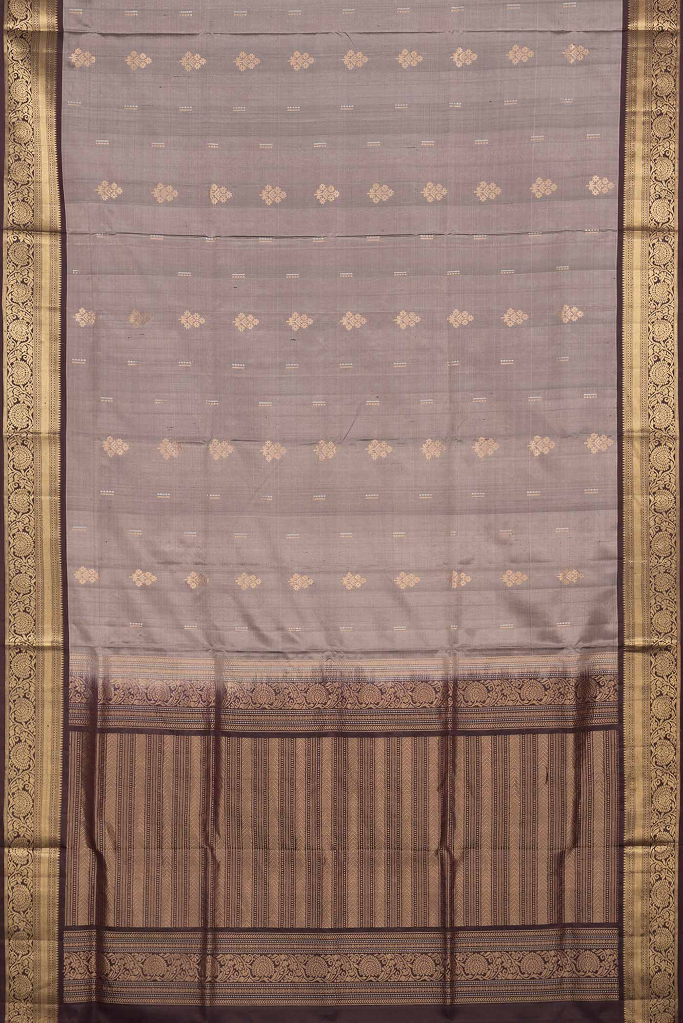 Flat view of Grey Dual Tone Soft Silk Saree with Zari Butta on the body and Zari Border. 
