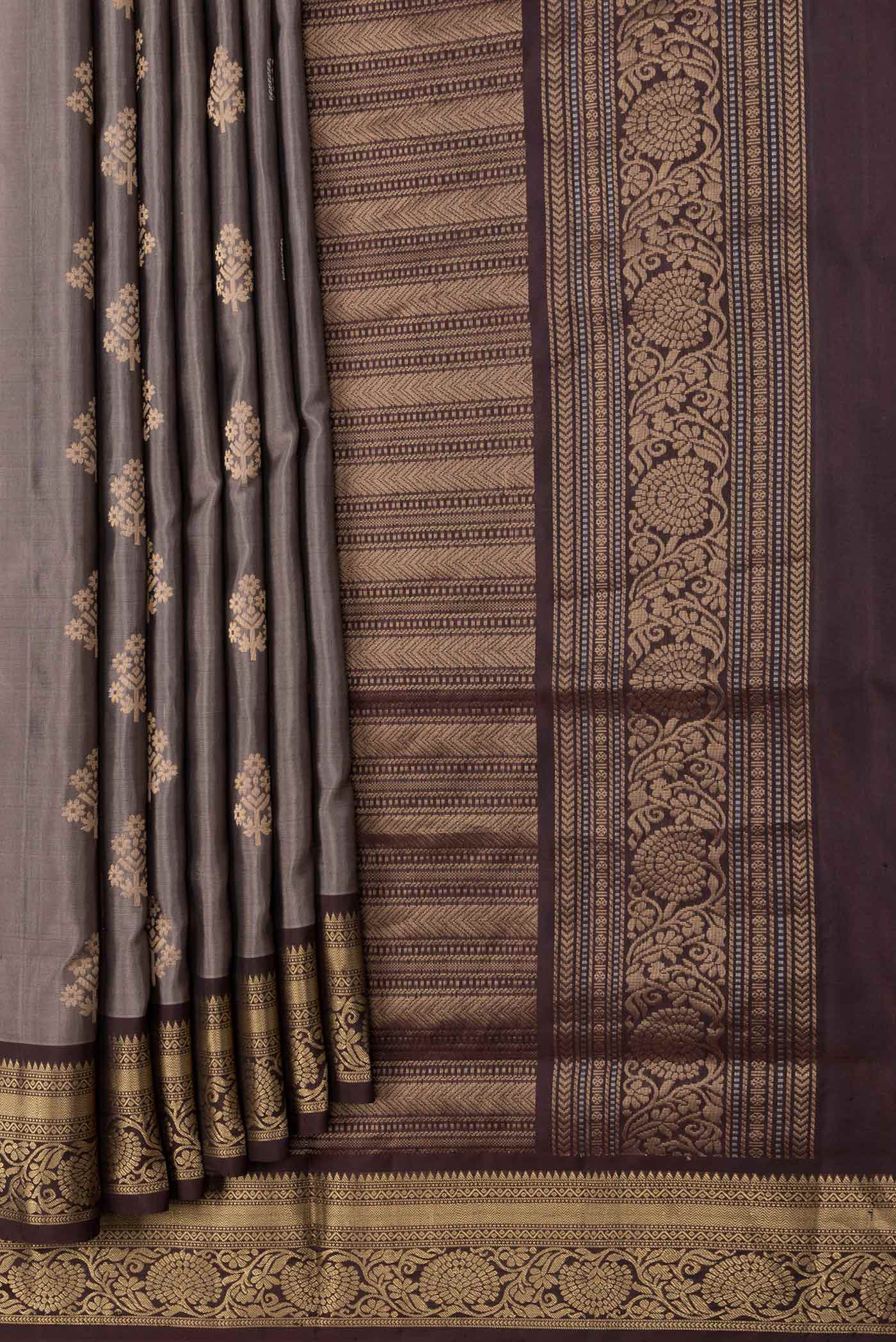 Pleats and pallu of Grey Dual Tone Soft Silk Saree with Zari Butta on the body and Zari Border. 