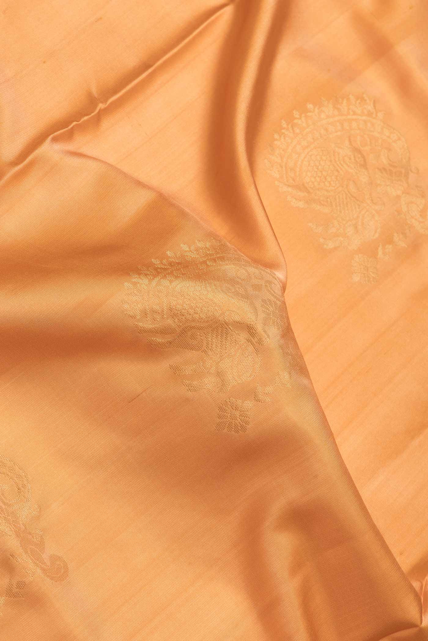 Close up of Sandal Dual Tone Soft Silk Saree with Zari Butta on the body and Zari Border.  displaying folds