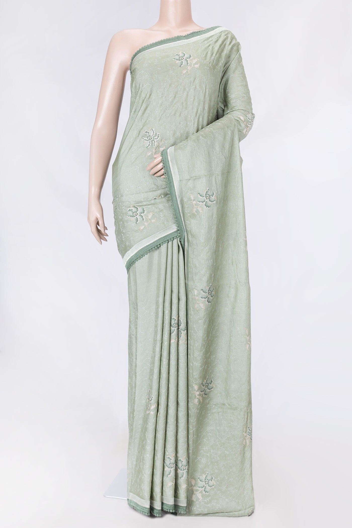 Green Dual Tone Tussar Saree with Embroidery on the body and Embroidery Border displayed on a mannequin