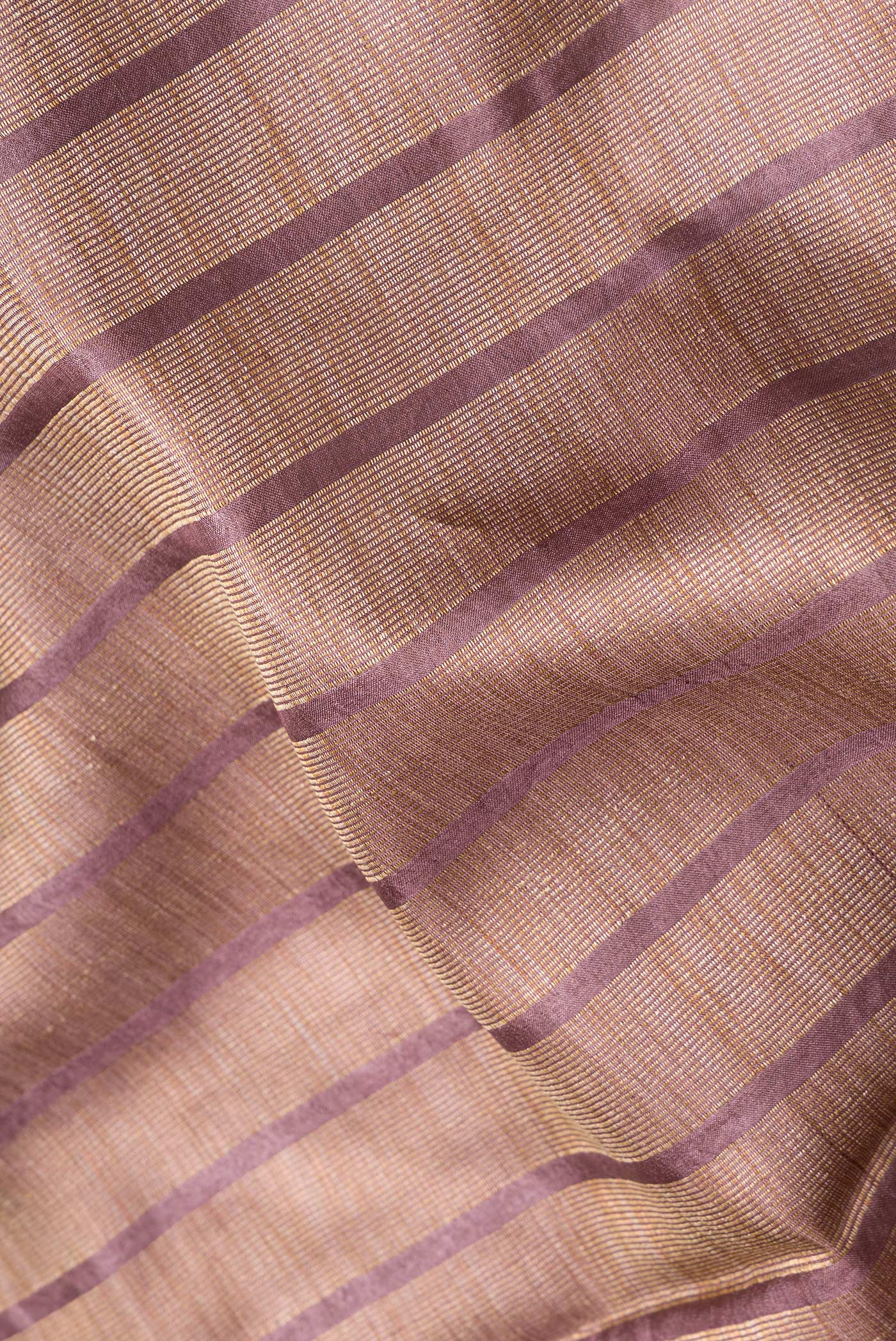 Close up of Maroon Dual Tone Tussar Silk Saree with Stripes on the body and Embroidery Border.  displaying folds